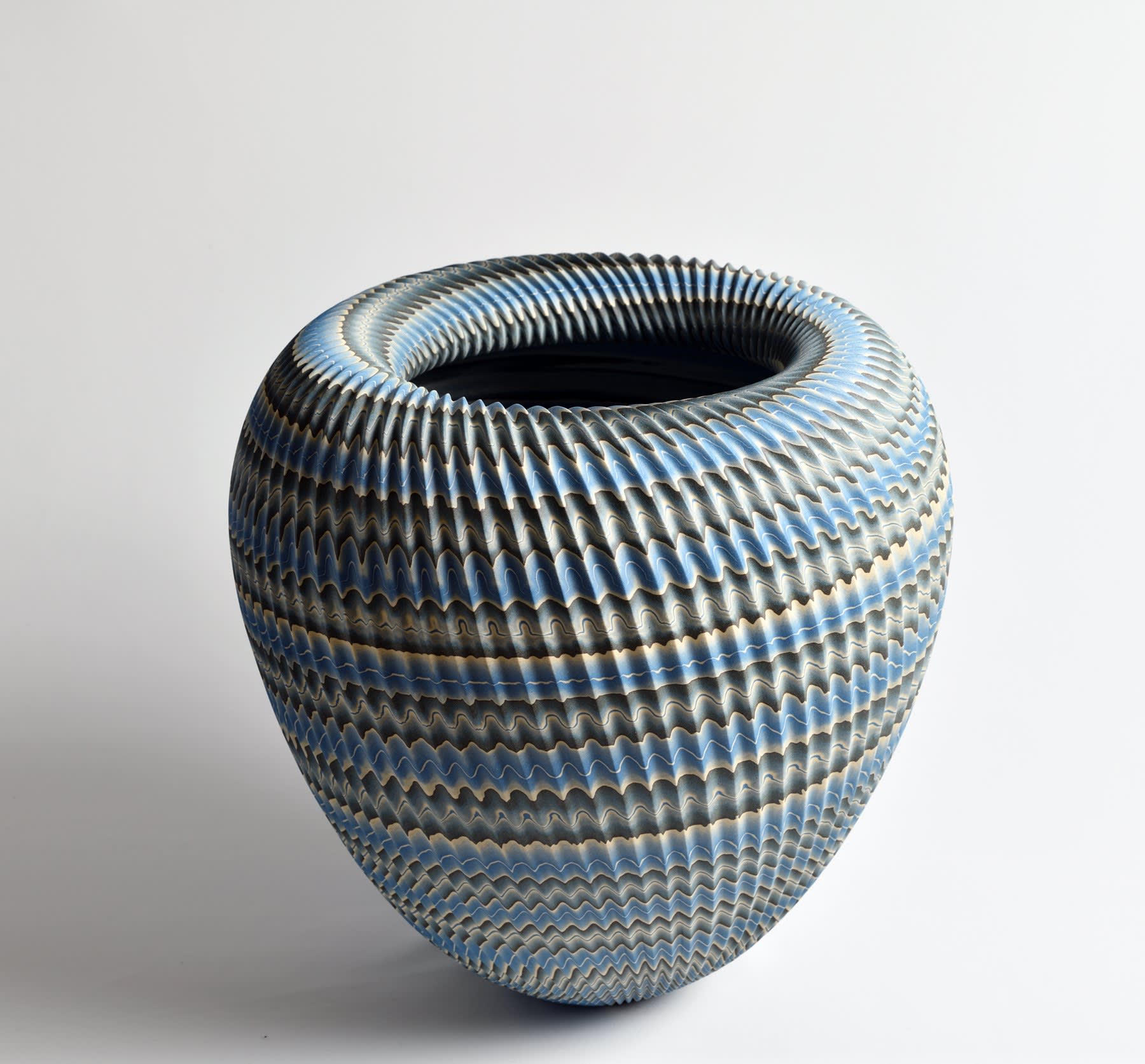 Ogata Kamio (b. 1949) Neriage (marbleized) conical vessel with carved, ridged surface and wide rolled collar titled "Abyss" 2019 Marbleized stoneware with transparent matte glaze 12 1/4 x 12 1/8 x 12 1/8 in. Inv# 11248 SOLD