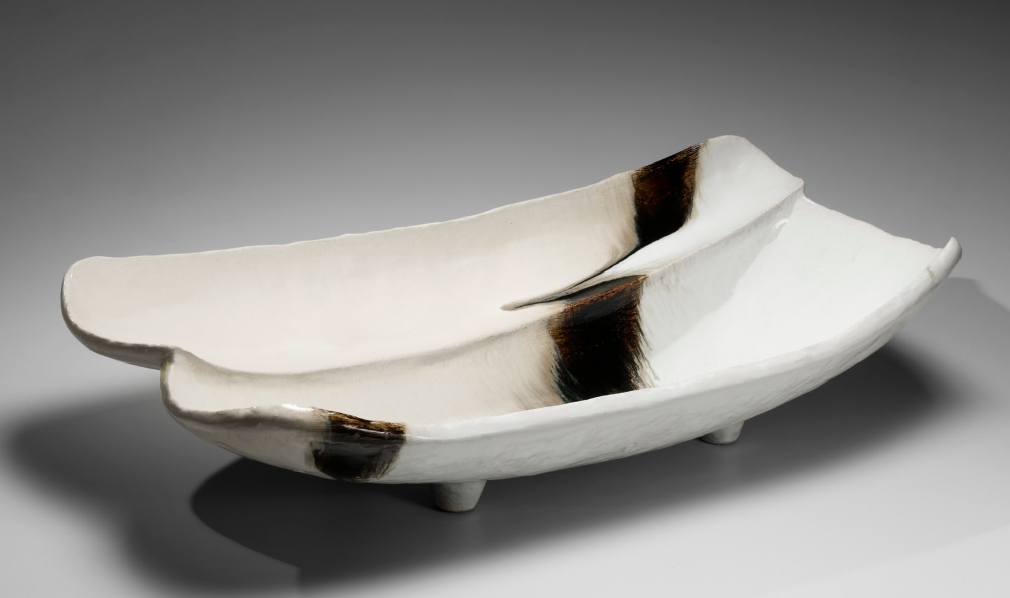 NISHIHATA TADASHI (b. 1948) Vessel with two oblong concave sections, four short feet all covered with a thick Tamba ash glaze 2018 Tamba ash-glazed stoneware 7 x 29 1/2 x 14 1/2 in. Inv# 11078