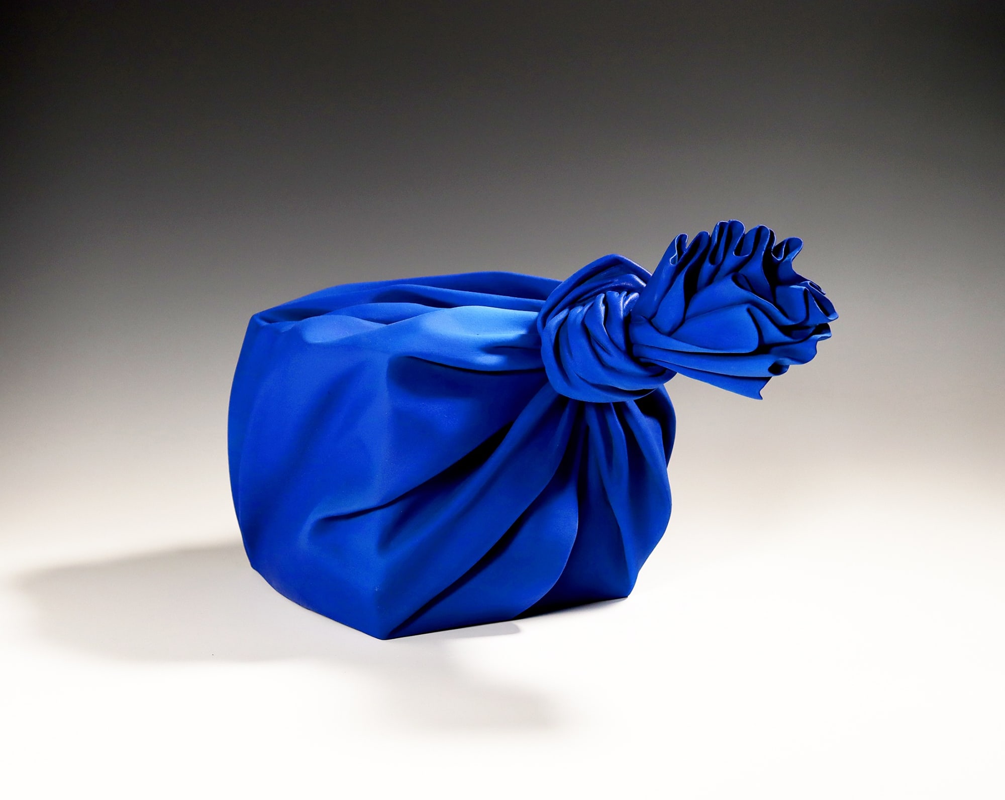 Tanaka Yū (b. 1989) Cobalt blue sculpture in the shape of a furoshiki (wrapping cloth)-enclosing a square box 2020 Matte-glazed stoneware 9 7/8 x 15 3/4 x 10 1/4 in. Inv# 11726 SOLD