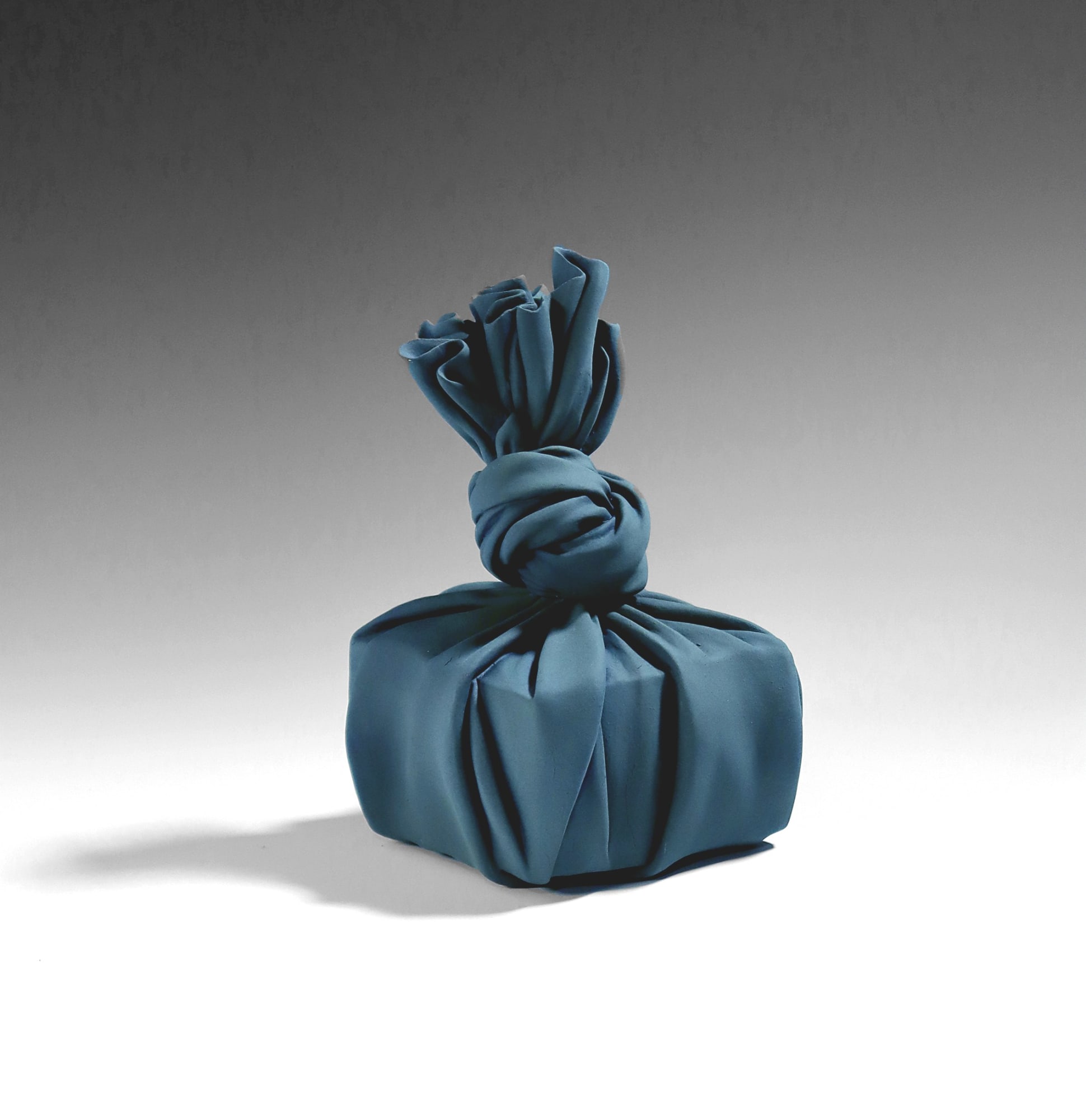 Tanaka Yū (b. 1989) Turquoise sculpture in the shape of furoshiki (wrapping cloth) enclosing a small square box 2020 Matte-glazed stoneware 7 1/8 x 4 3/8 x 4 3/4 in. Inv# 11730 SOLD