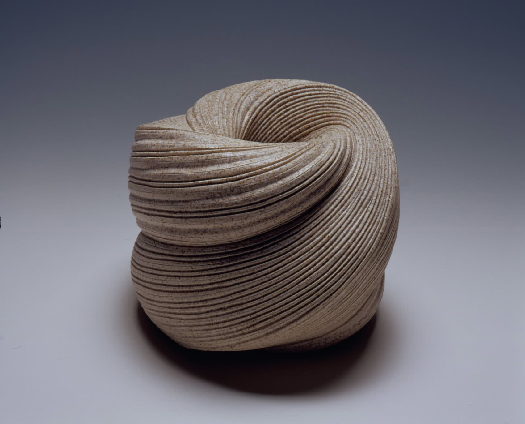 Large undulating vessel with indentation in center and diagonally incised cascading folds 2007 Stoneware 9 7/8 x 11 5/8 x 13 inches Inv# 5448