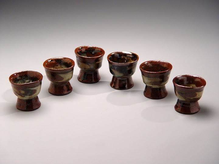 Ueda Tsuneji (1914-1980) Set of six nerikomi sake cups with brown, black, beige abstract patterning on elevated foot, ca. 1968 Glazed stoneware 2 3/8 x 2 1/2 inches Inv# 4353