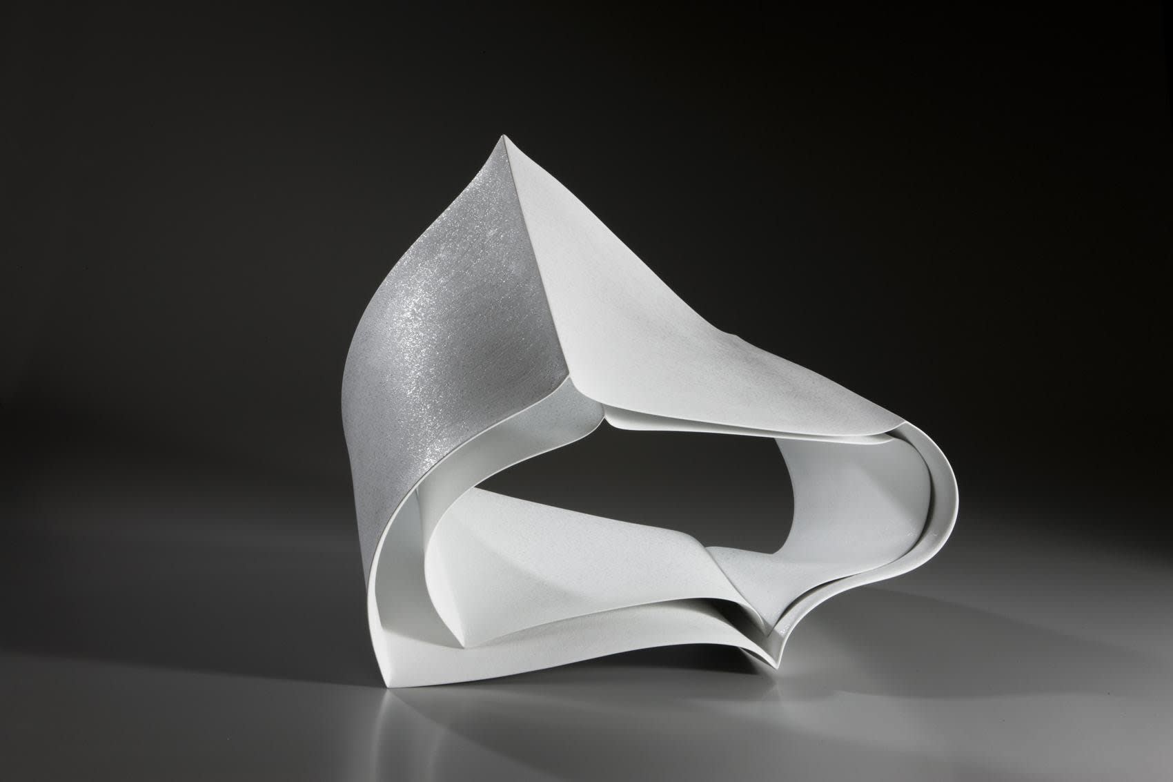 Ceramic sculpture titled 'Forms in Succession #10' 2010 Porcelain with white glaze and spotted patterning 16 x 19 1/2 x 15 inches Inv# 6501