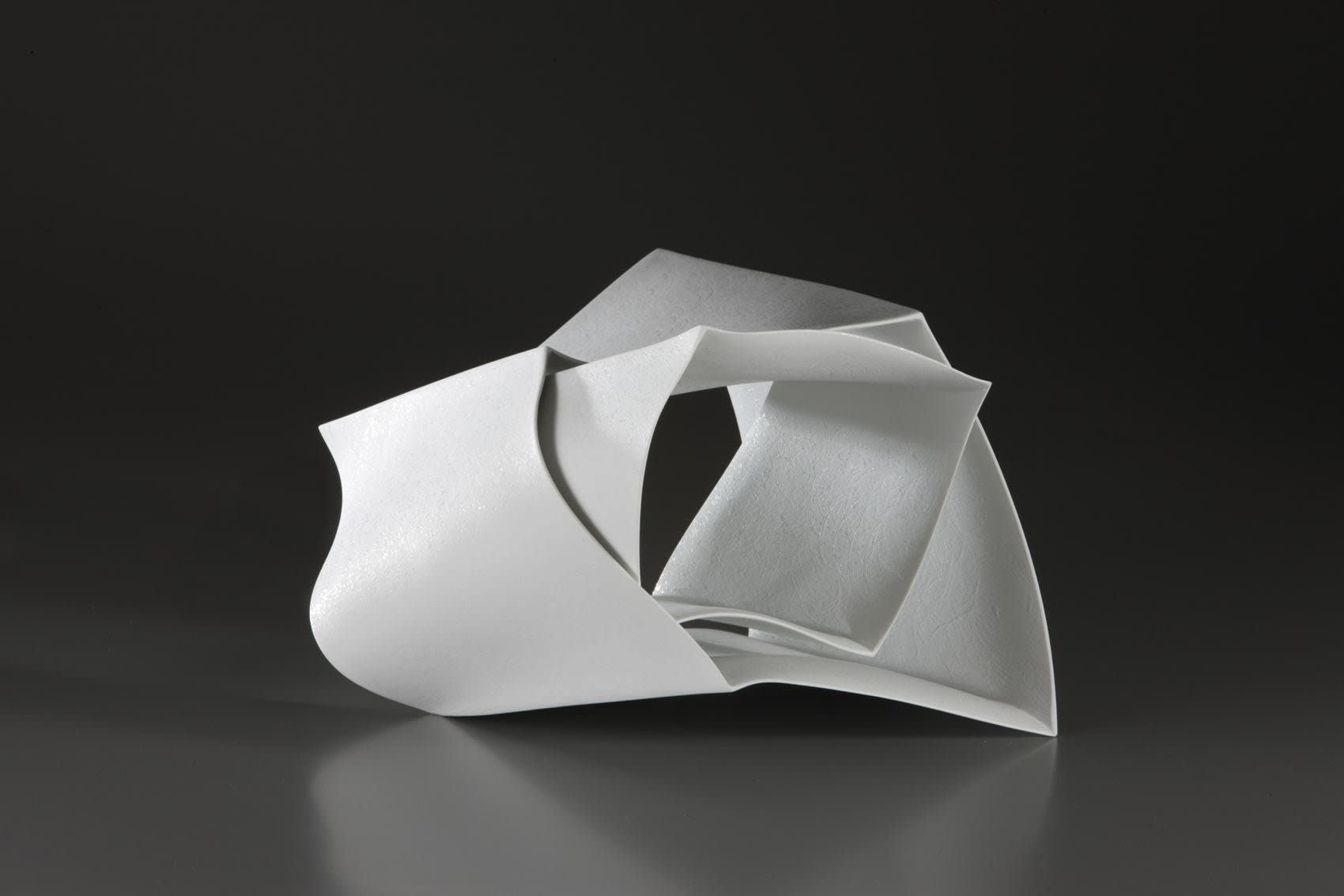 Ceramic sculpture titled 'Forms in Succession #21' 2010 Porcelain with white glaze and spotted patterning 7 x 8 3/4 x 11 inches Inv# 6512