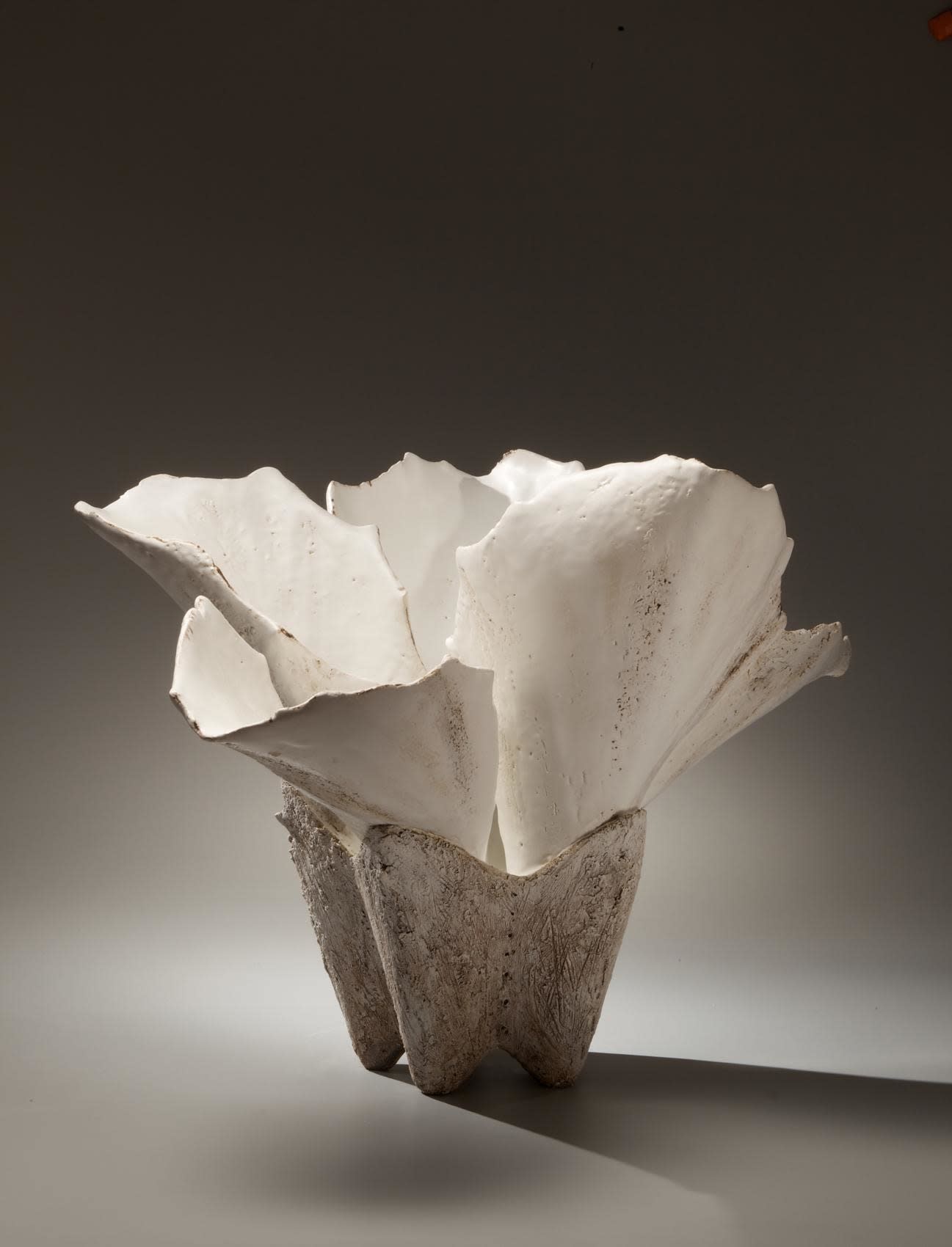 Large flower shaped vessel with pointy leaves and dark textured base,2008 Stoneware with white and iron oxide glazes 22 x 30 x 23 5/8 inches KS#1/Inv# 6515