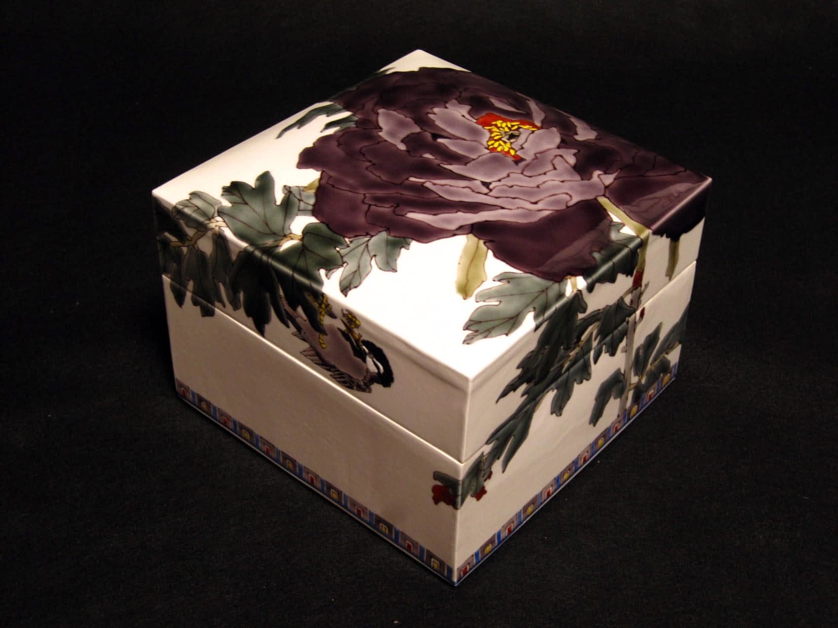 Covered square box with a large purple peony blossom and a sparrow, 2010 Porcelain with polychrome enamel glazes 6 1/2 x 3/8 inches Inv# 6684 SOLD