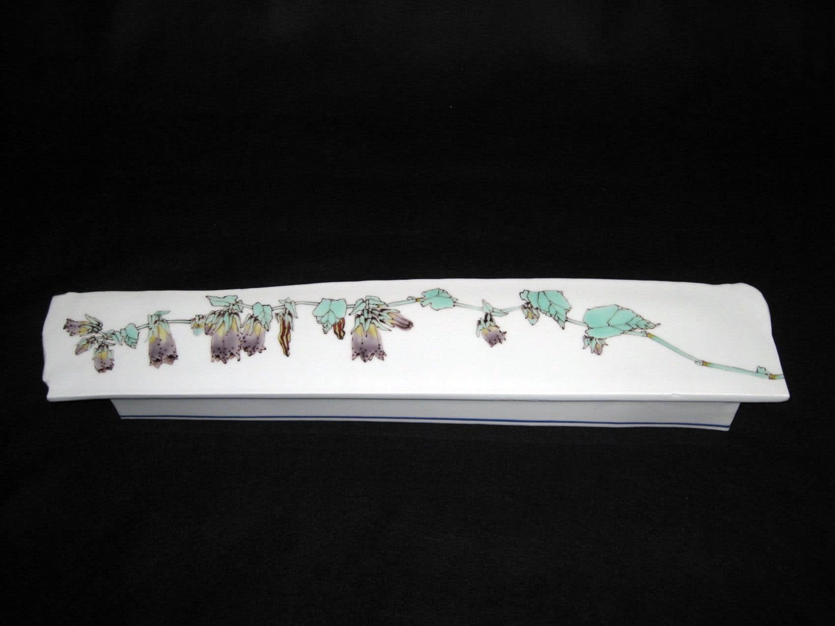 Narrow footed platter with floral design of bell flowers, 2010 Porcelain with polychrome enamel glazes 2 1/8 x 4 x 20 3/4 inches Inv# 6680 SOLD
