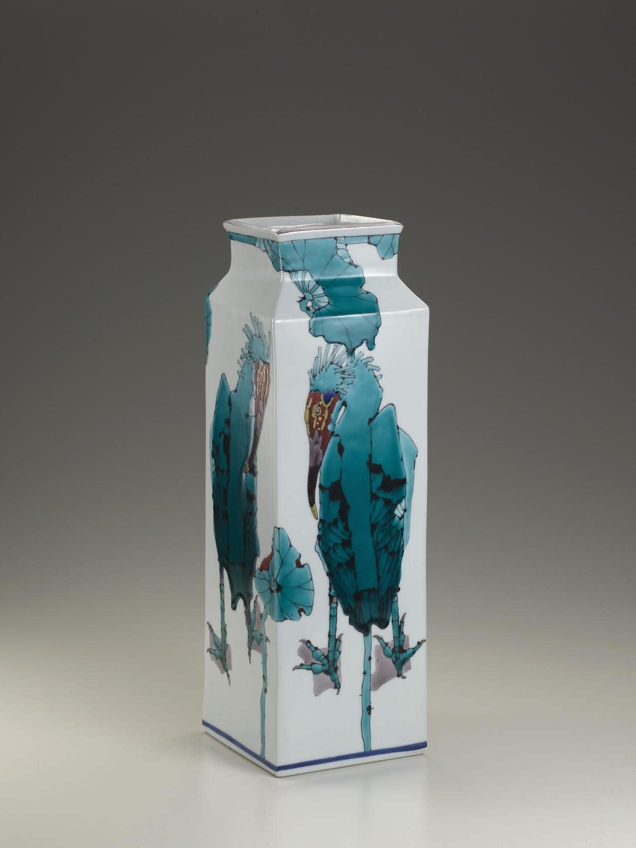 Tall square vase decorated with blue Japanese crested ibises and lotus plants, 2010 Porcelain with polychrome enamel glazes 18 3/4 x 6 inches Inv# 6665 SOLD