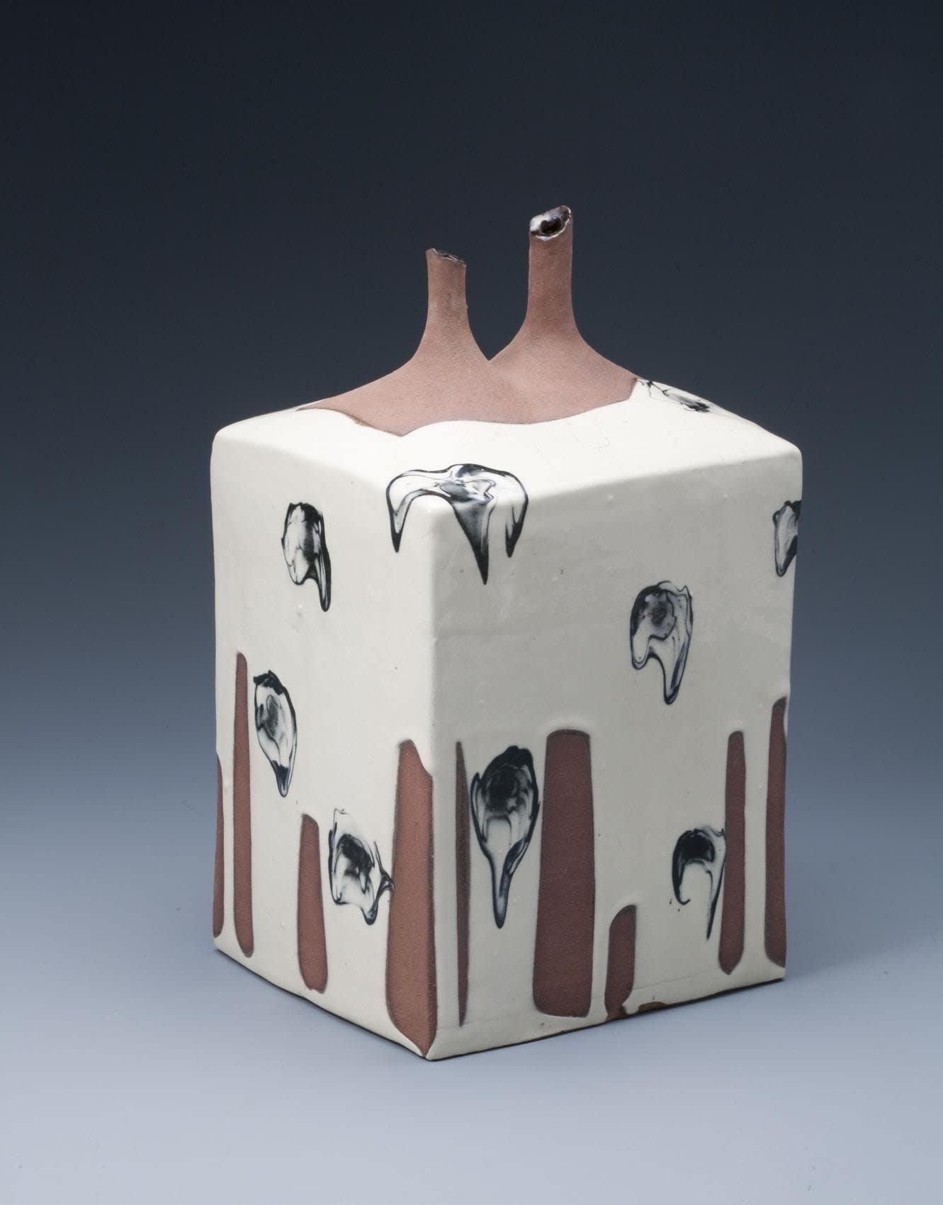 Kondo Yutaka (1932 - 1983) Square stoneware sculptured vessel with white slip and black ink glazes and double tapered mouths , 1964 Stoneware with slip glaze 12 1/4 x 7 1/2 x 6 3/4 inches SOLD