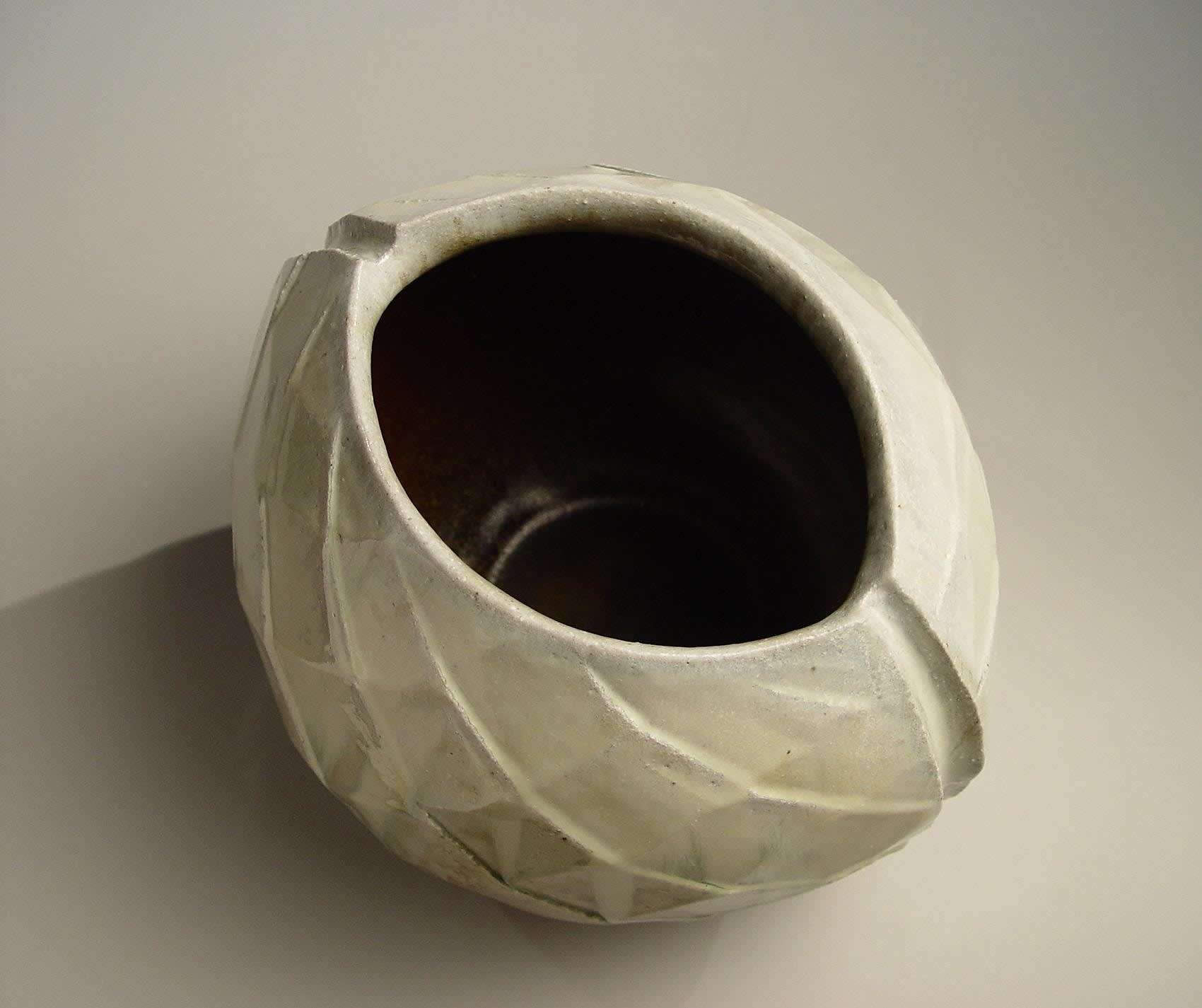 Wide mouthed spherical Tanba vessel with diamond-shaped carved surface patterning and ladle-poured ash glaze, 2010 Wood-fired stoneware with ash glaze 10 1/4 x 12 1/4 x 10 5/8 inches; Inv# 6891 SOLD
