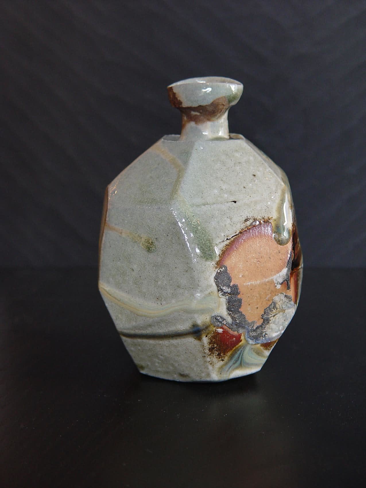 Faceted Tanba tokkuri (sake flask) with light-colored natural ash glaze, 2011 Wood-fired stoneware with natural ash glaze and kiln effects 6 x 4 1/2 inches; Inv# 6935 SOLD