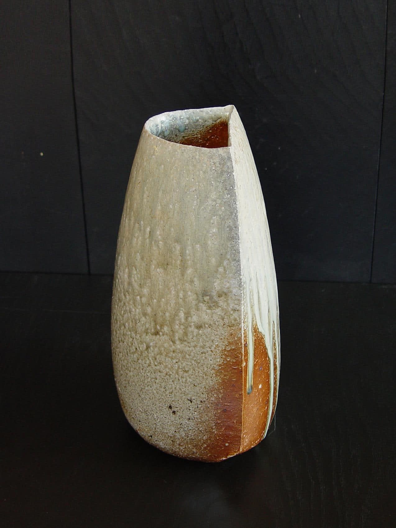 Tilting Tanba vase with moon-shaped opening and natural dripping ash glaze; 2011 Wood-fired stoneware with ash glaze 12 x 6 7/5 x 6 1/4 inches; Inv# 6930 SOLD