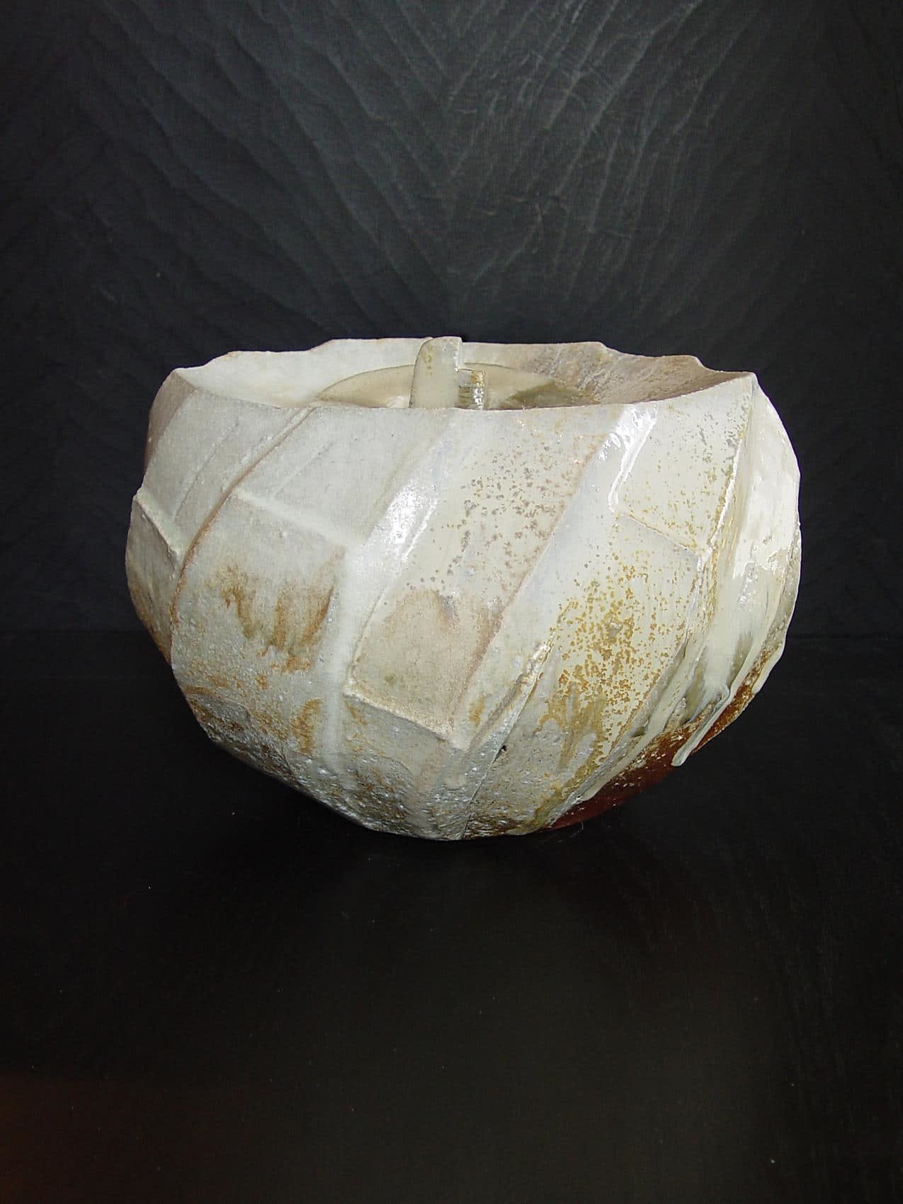 Oval covered Tanba water storage jar with ash glaze covering diagonal banding, 2011 Wood-fired stoneware with ash glaze 7 5/8 x 9 x 10 3/4 inches; Inv# 6924 SOLD