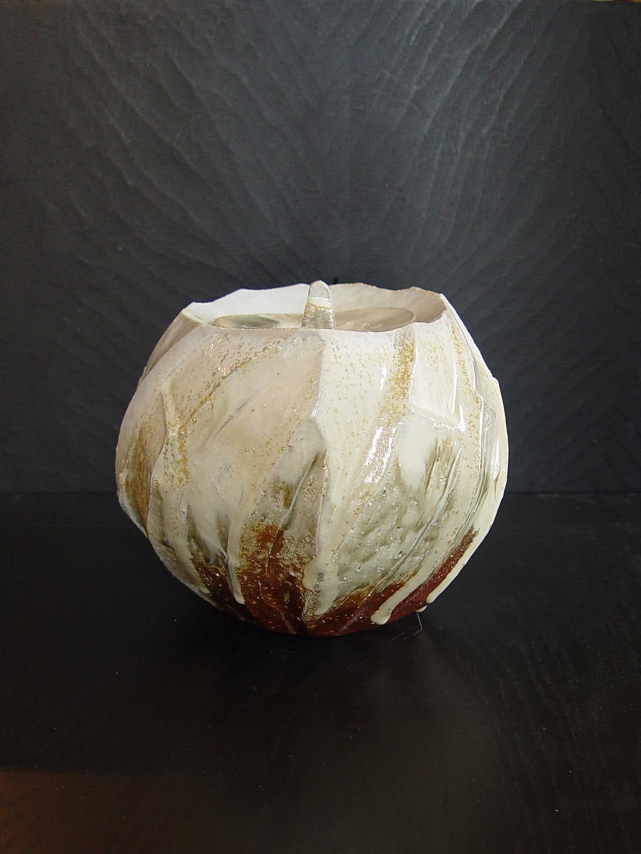 Oval covered Tanba water storage jar with ash glaze covering diagonal banding, 2011 Wood-fired stoneware with ash glaze 7 5/8 x 9 x 10 3/4 inches; Inv# 6924 SOLD