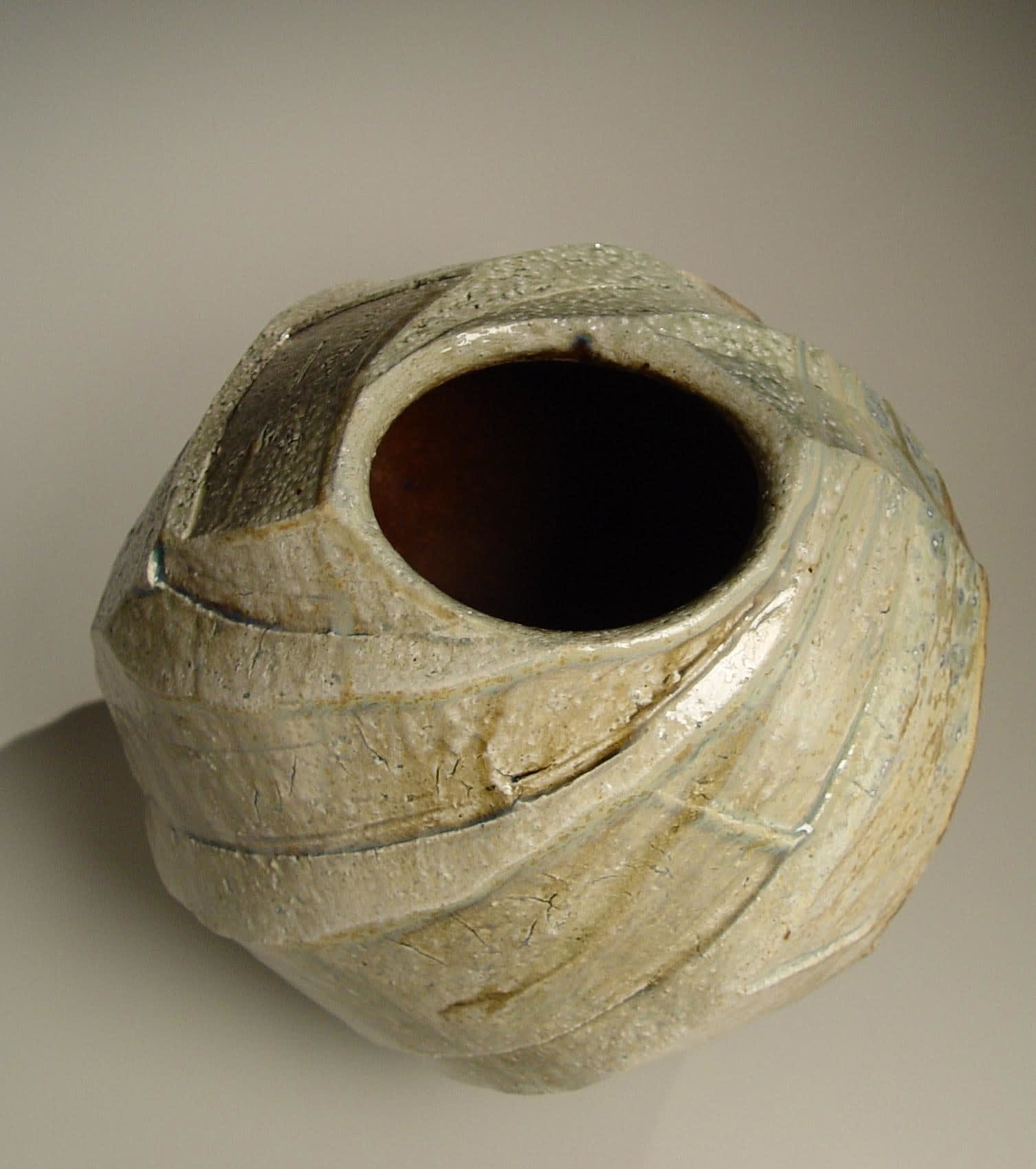 Spherical Tanba vessel with faceted diagonal banding and dripping natural ash glaze and markings from impressed shells, 2011 Wood-fired stoneware with natural ash glaze 13 1/2 x 14 1/2 inches; Inv# 6888 SOLD