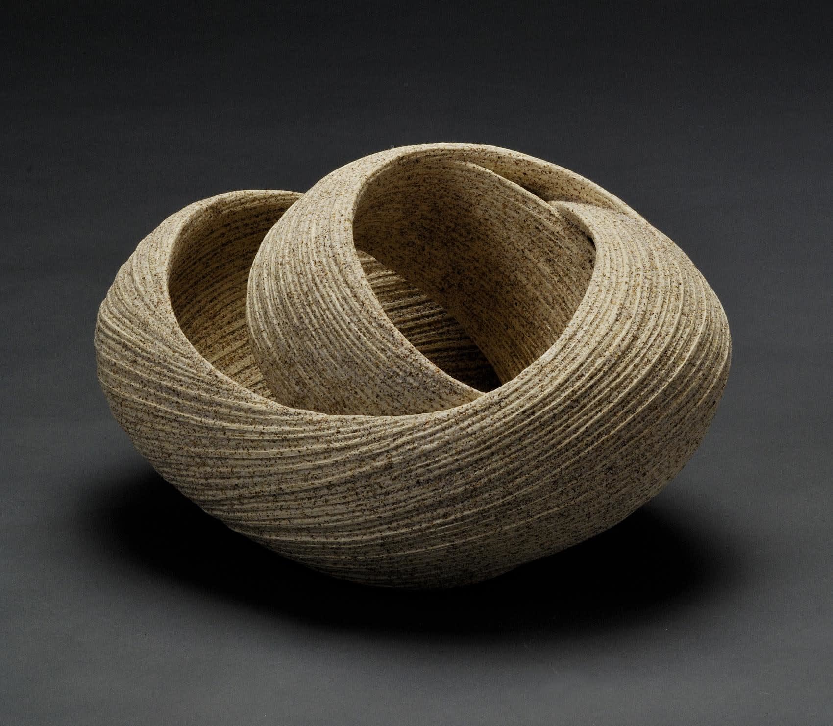 Sakiyama Takayuki (b. 1958) Elliptical twisting open sculpture with carved surface, 2011 Stoneware with sand glaze 8 3/4x x9 1/2 x 14 1/4 inches