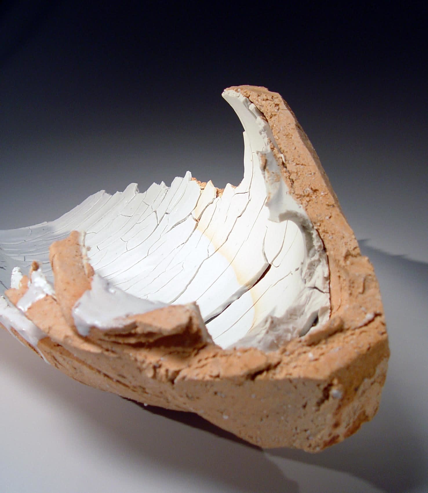 OGAWA MACHIKO (b. 1946) Elongated curved platter-like vessel with rough hewn edges and cracked surface Layers of porcelain and stoneware clays and some white glaze 9 1/2 x 22 x 13 inches Inv# 7327 SOLD