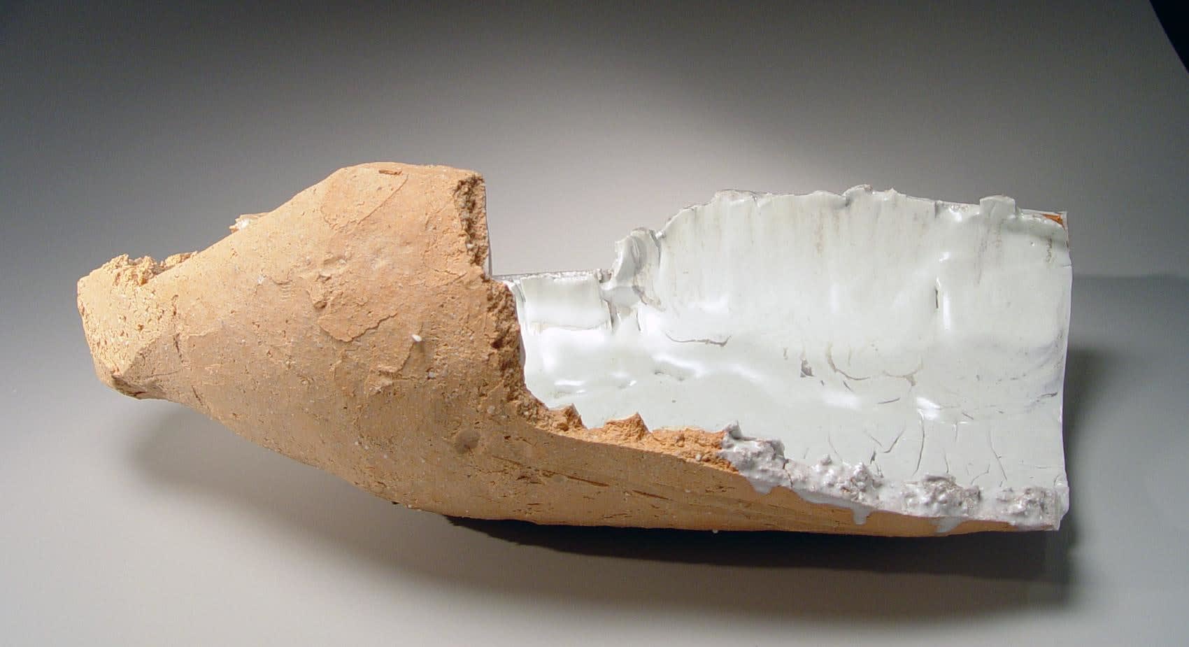 OGAWA MACHIKO (b. 1946) Elongated curved platter-like vessel with rough hewn edges and cracked surface Layers of porcelain and stoneware clays and some white glaze 9 1/2 x 22 x 13 inches Inv# 7327 SOLD
