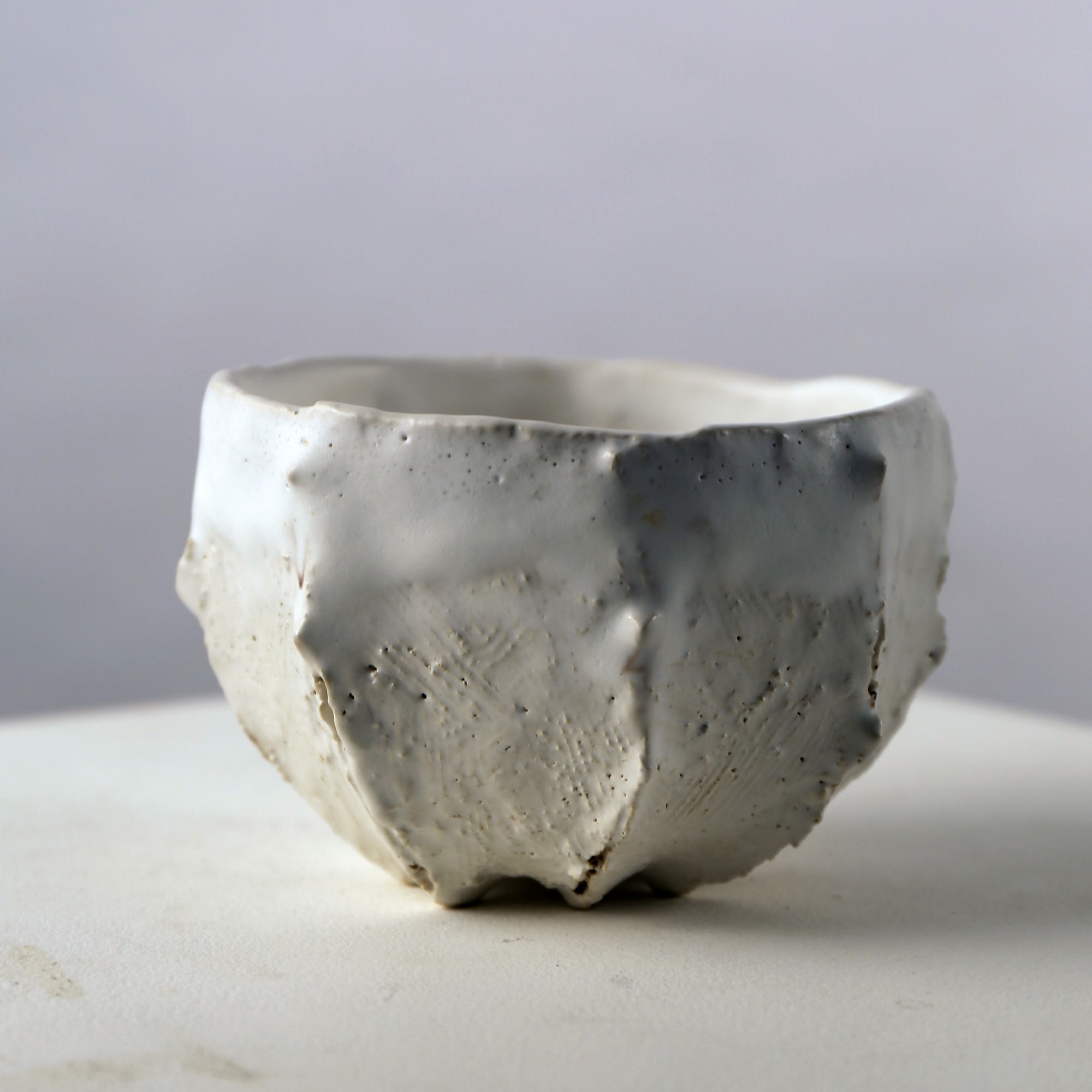 Matte white-glazed ribbed teabowl with small protrusions and interior pool of crackled glaze 2007 Glazed stoneware 3 1/8 x 4 3/4 x 4 3/4 in. Inv# 8233