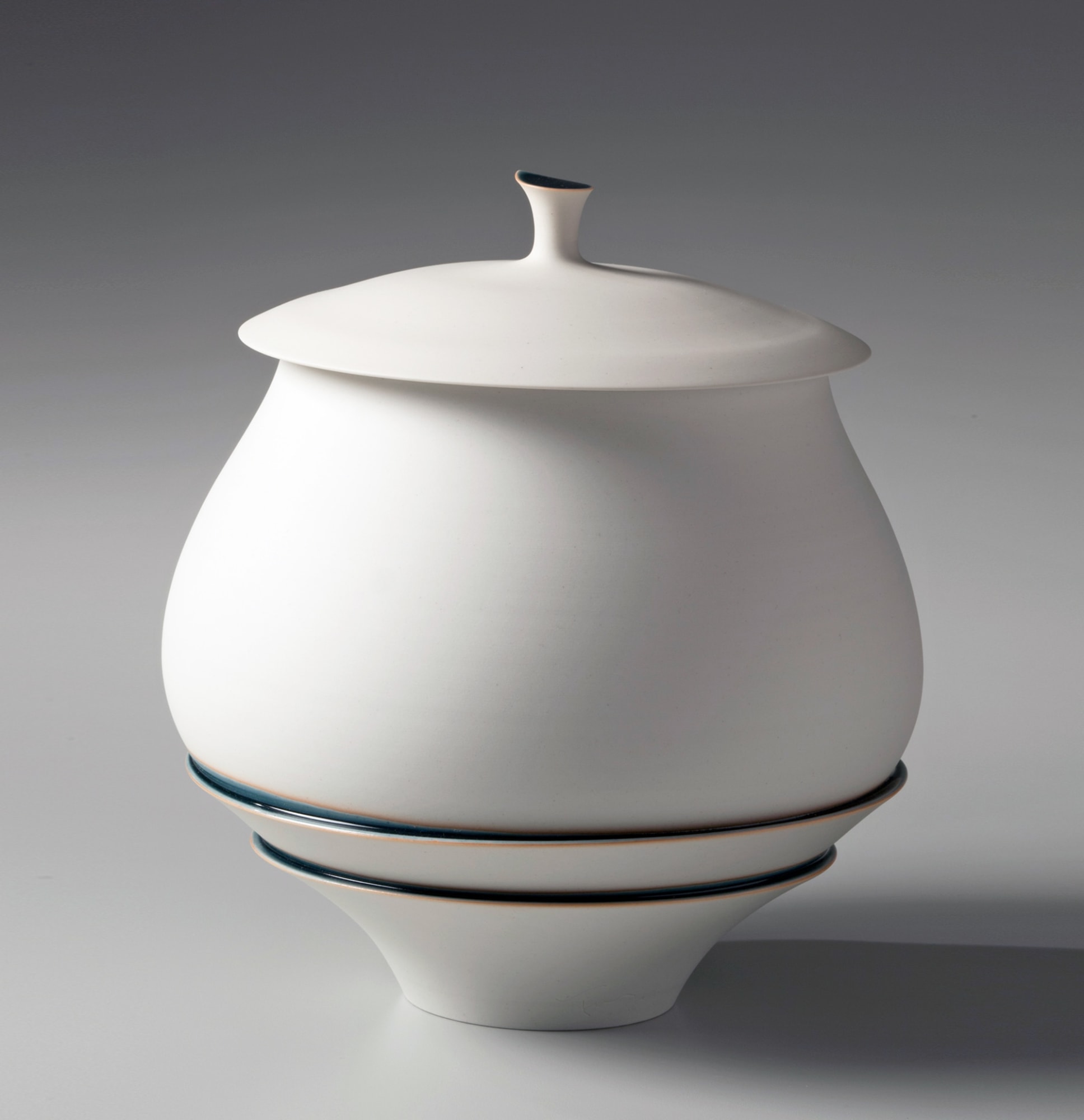 Unglazed mizusashi (water jar) held together by bands of blue glaze and underside of lid in silver 2014 Unglazed porcelain with blue glaze and silver leaf 8 1/4 x 8 5/8 x 8 5/8 in. Inv# 8566