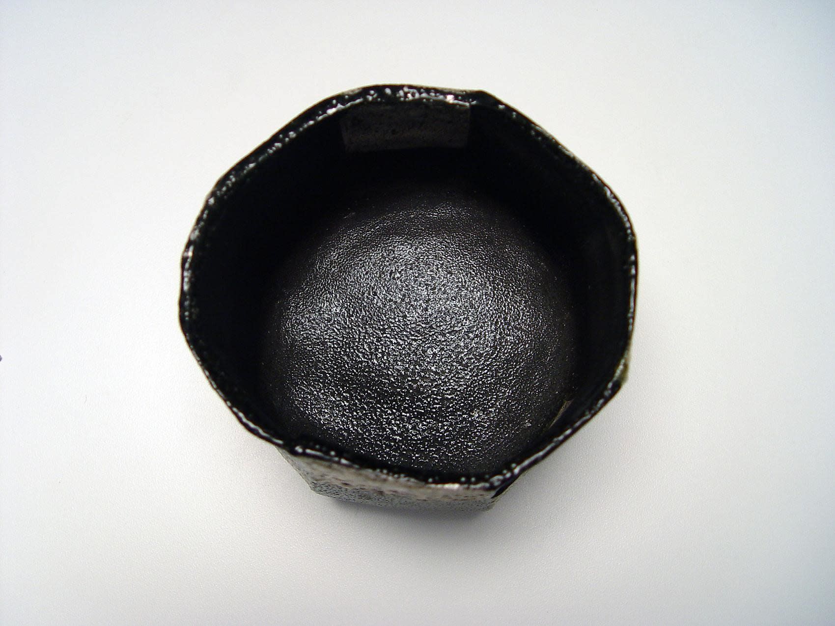 Ajiki Hiro (b. 1948) Basara faceted teabowl with checkerboard patterning in black and silver glazes, 2012 Salt-glazed stoneware 4 x 4 3/4 in. Inv# 8042