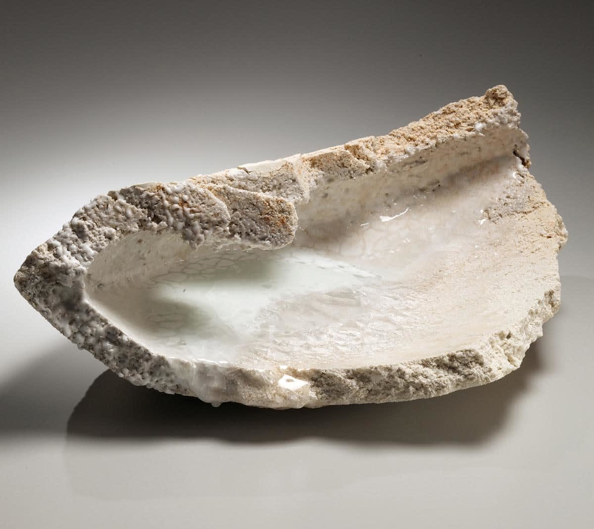 Torn, triangular sculpture with pooling while translucent crackled glass 2014 Unglazed multi-fired porcelain with glass 7 7/8 x 22 3/8 x 14 1/8 in.