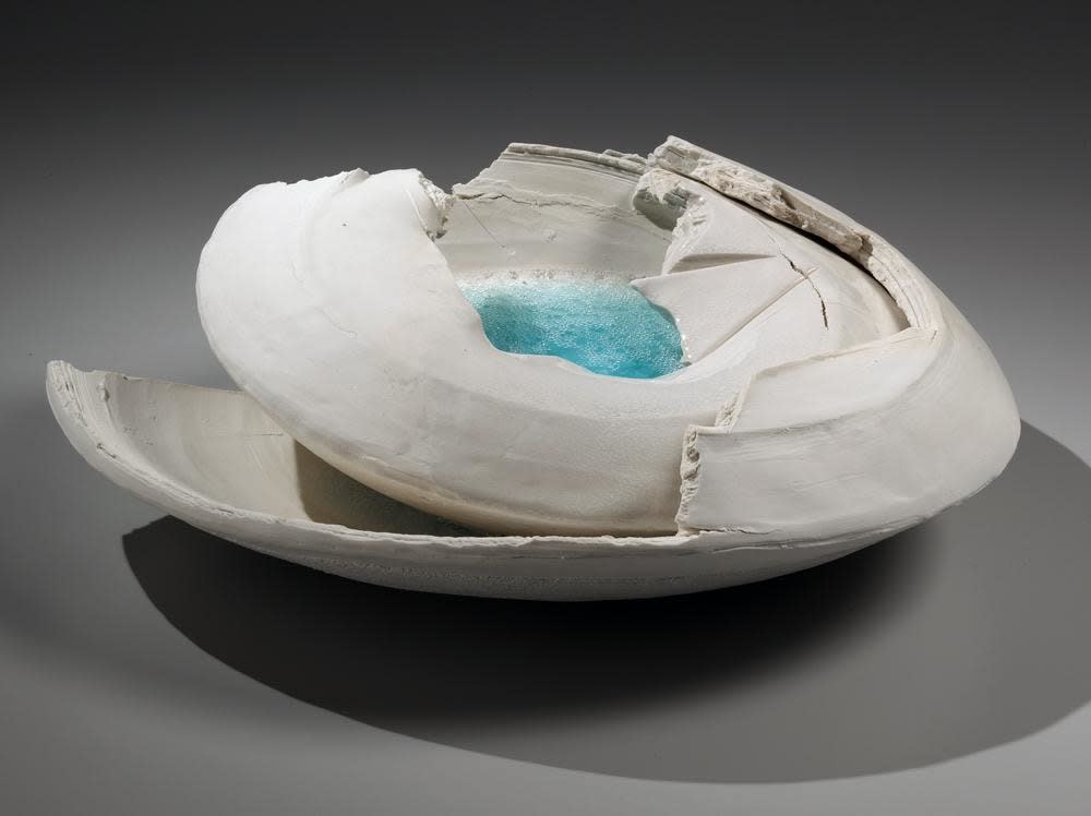 Layered, rounded vessel with pooling blue-green crackled glass in center and torn sectional edges, 2014 Unglazed multi-fired porcelain with glass 5 1/2 x 18 1/2 x 15 3/8 in.
