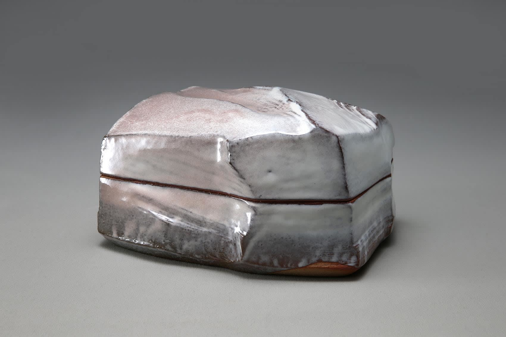 Hagi white-glazed rectangular box with white, pink and grey tones in the glaze, and kiln effects along the base, 2012 Glazed stoneware 5 7/8 x 9 x 7 3/4 in. Inv# 9056