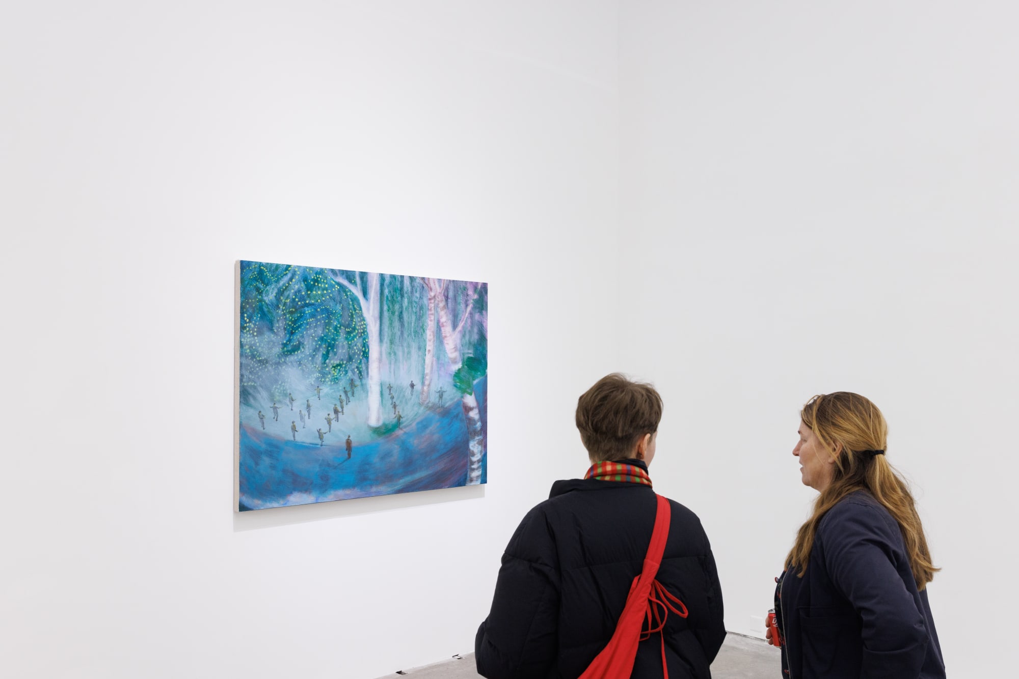 Installation view of Anna Ngan Leong Cheung's work The Poplars created in 2025 where two female visitors stand in front of this work.