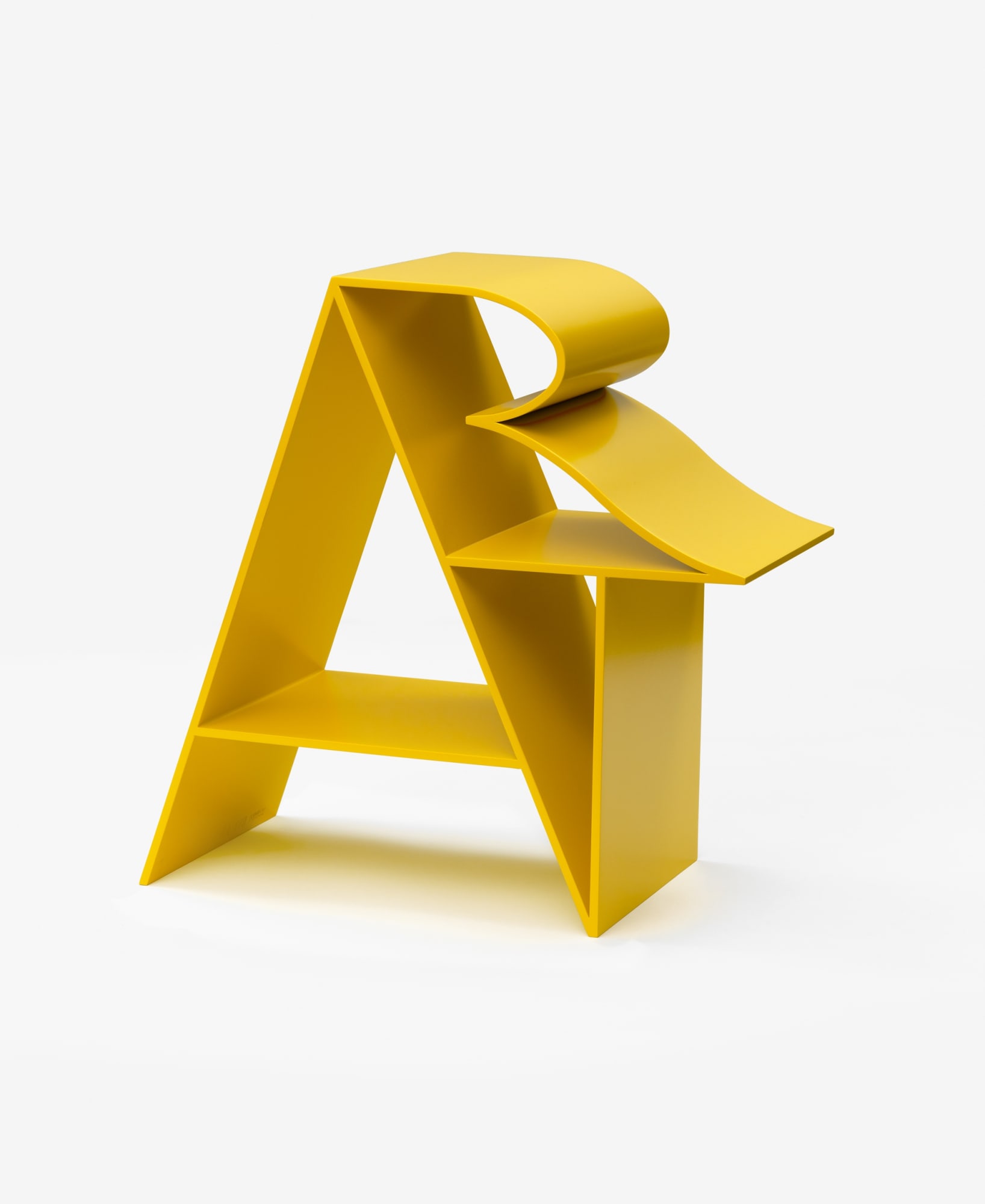 Yellow sculpture by Robert Indiana of the word ART