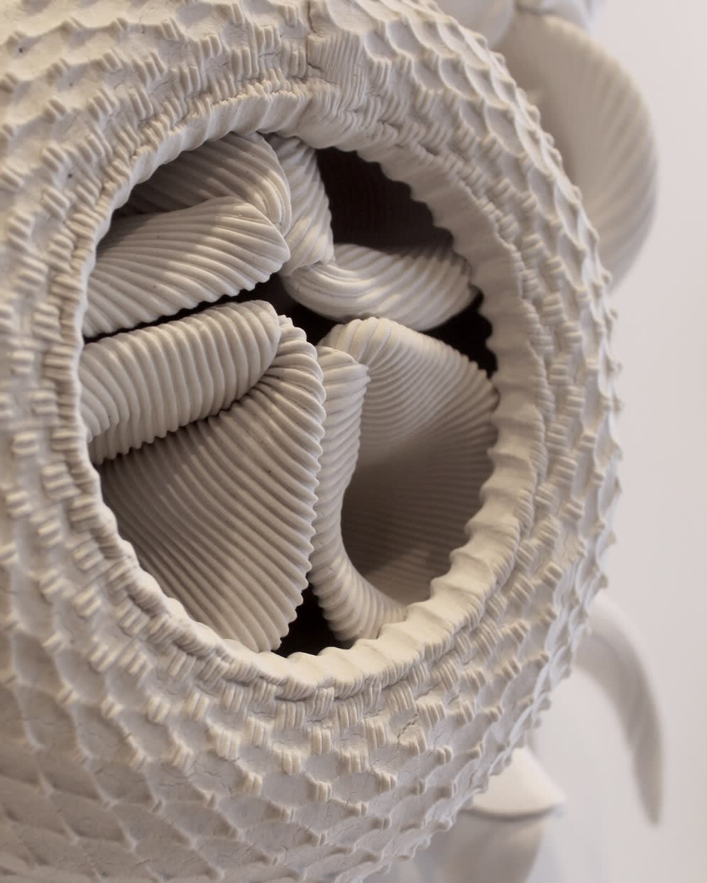 Depicted above are two images showcasing a sculpture by Charles Birnbaum. The detail shots allow you to understand the full extent of texture and detail embedded into the porcelain.