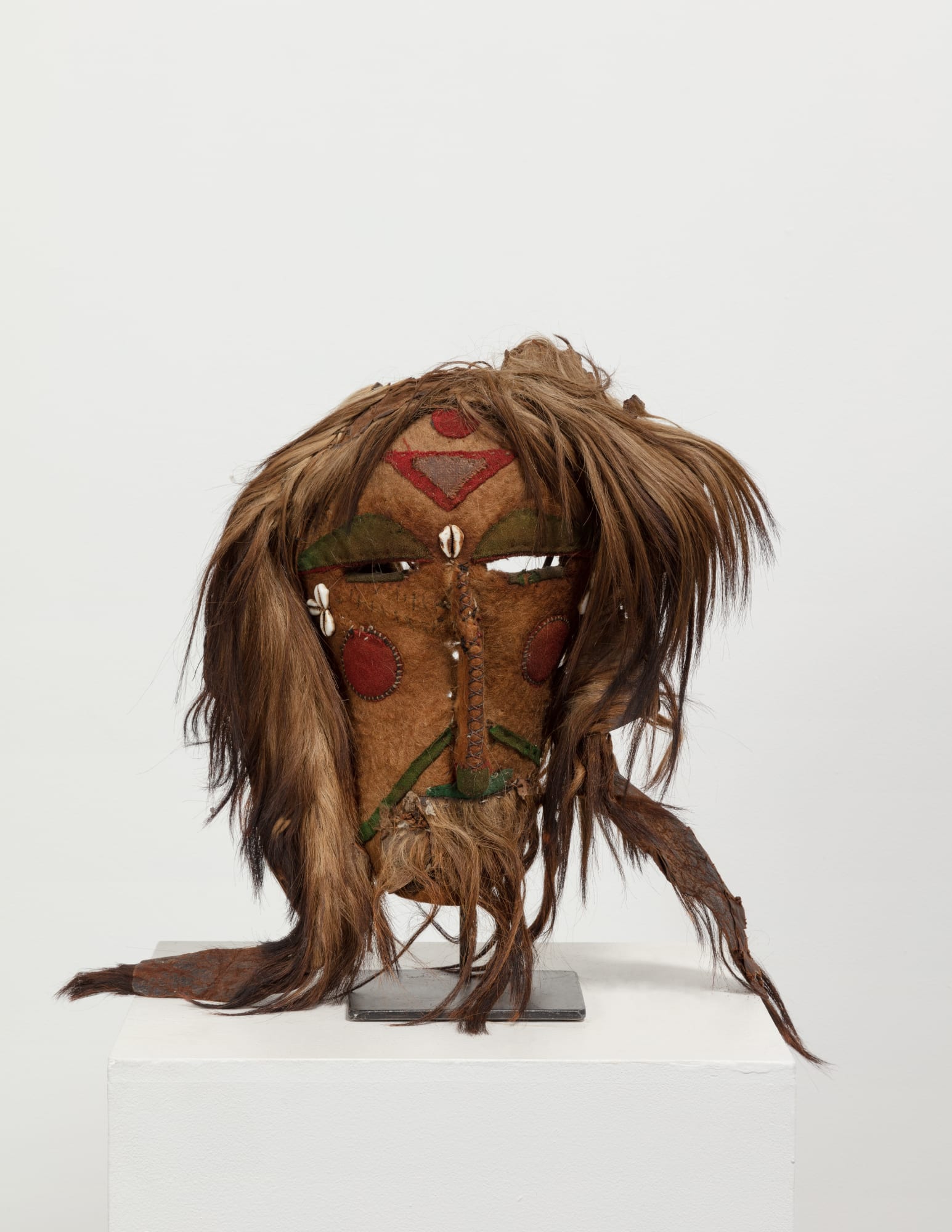 Sherdukpen Dance Mask, Arunachal Pradesh, Early 20th century; Northeast India. Felt, goat hair, cowrie shell and pigment. 24'' x 13'' x 6'' (61 x 33 x 15 cm)