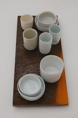 Edmund DE WAAL (b.1964) 9 circles I, 2011 Edition 1 of 10 A series of corten steel slabs each with 9 thrown porcelain vessels in celadon, grey and white glazes 5 7/8 x 13 ¾ x ½ inches / 15 x 35 x 2 cm