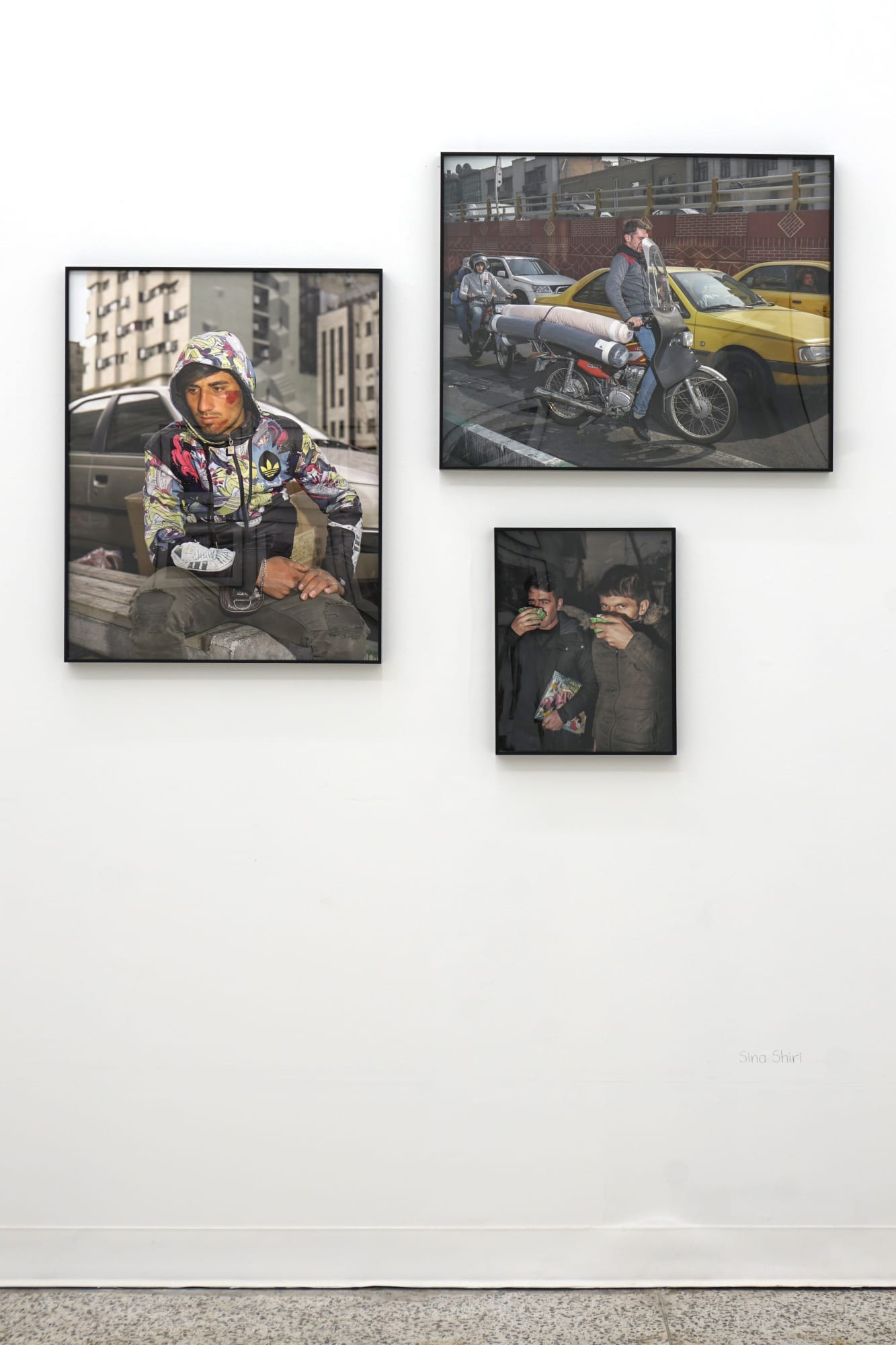 Installation view of Right About Here a group presentation of photographs by Arash Hanaei, Alborz Kazemi, Newsha Tavakolian, Sina Shiri, Maryam Takhtkeshian, and Mehran Mohajer.