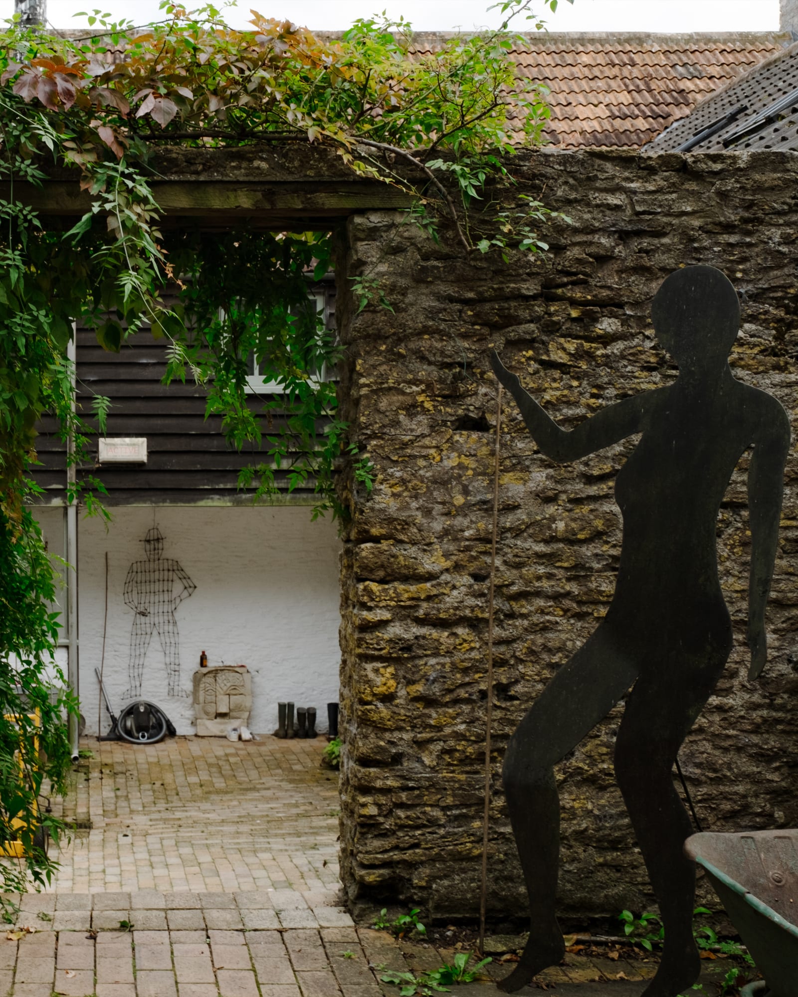Henry Piper's sculpture 'Guiding Shadow' leads into a courtyard with another of his works, 'Top Fruit' made out of bed springs