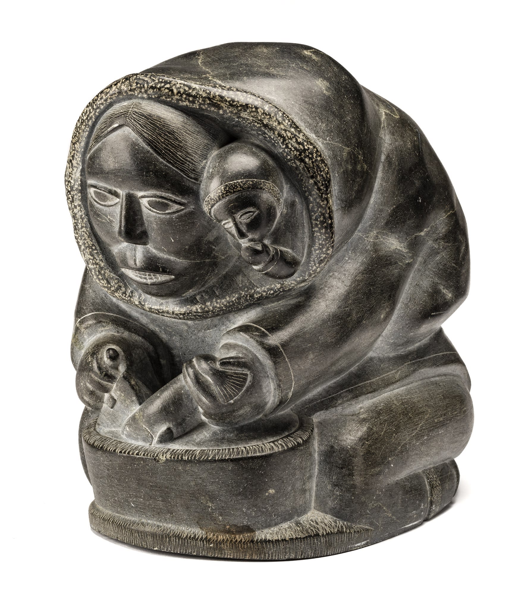 Lot 100 SAMSON NASTAPOKA (1931-) INUKJUAK (PORT HARRISON) Mother and Child, Cutting Up a Fish, c. 1960 stone, 11.5 x 8 x 11 in (29.2 x 20.3 x 27.9 cm) Estimate: $4,000— $6,000 Price realized: $4,320