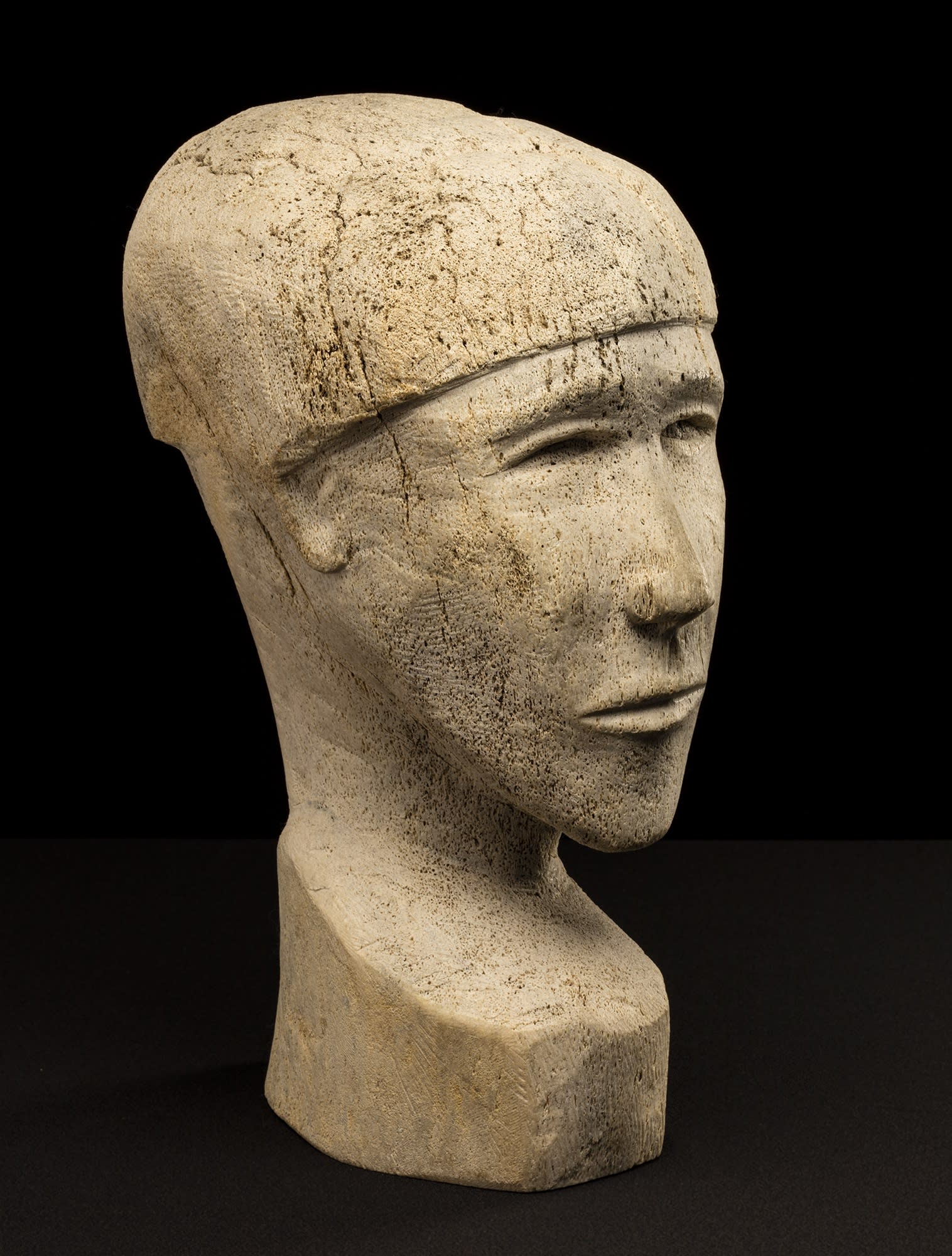 Lot 108 PAULOOSIE KAKEE (1933-) PANNIQTUUQ (PANGNIRTUNG) Portrait Bust of a Young Man, 1968 whale bone, 16 x 6.5 x 8.75 in (40.6 x 16.5 x 22.2 cm) Estimate: $1,000— $1,500 price realized: $2,160