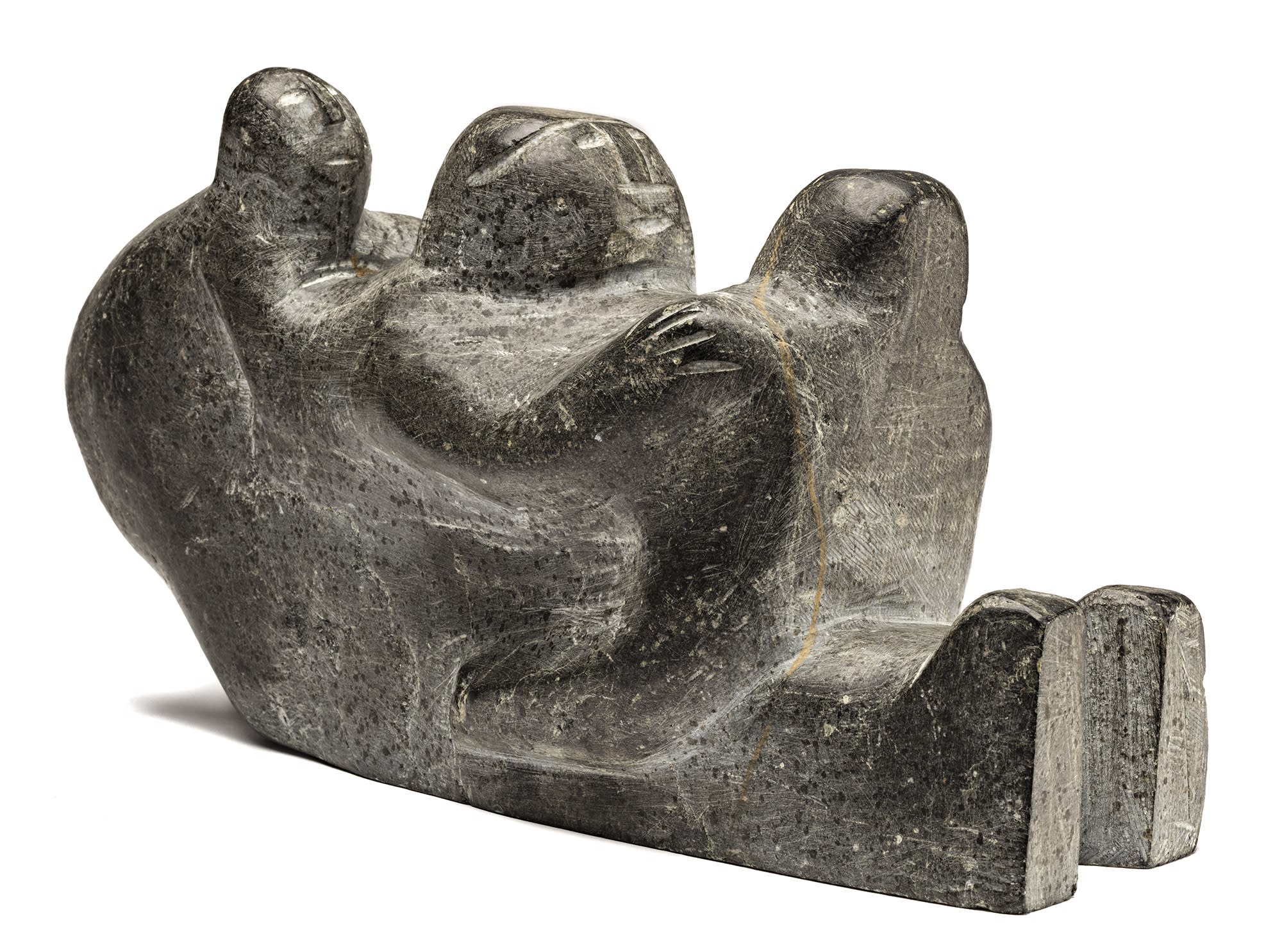 Lot 112 AUGUSTIN ANAROSUK (1917-1976) ARVIAT (ESKIMO POINT) Seated Mother Holding Her Two Children, mid-late 1960s stone, 6 x 11.25 x 4.25 in (15.2 x 28.6 x 10.8 cm) Estimate: $1,200— $1,800 Price realized: $1,200