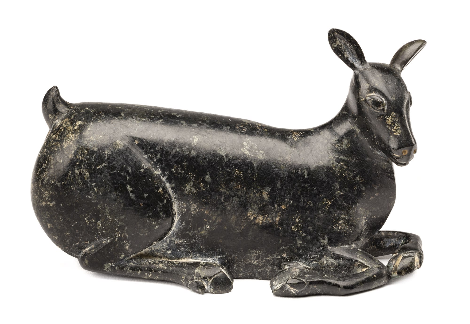 Lot 17 OSUITOK IPEELEE, R.C.A. (1922 or 1923-2005) m., KINNGAIT (CAPE DORSET) Resting Caribou Calf, c. 1960-62 stone, 4.5 x 5.5 x 2.25 in (11.4 x 14 x 5.7 cm) Estimate: $5,000 — $8,000 Price realized: $19,200