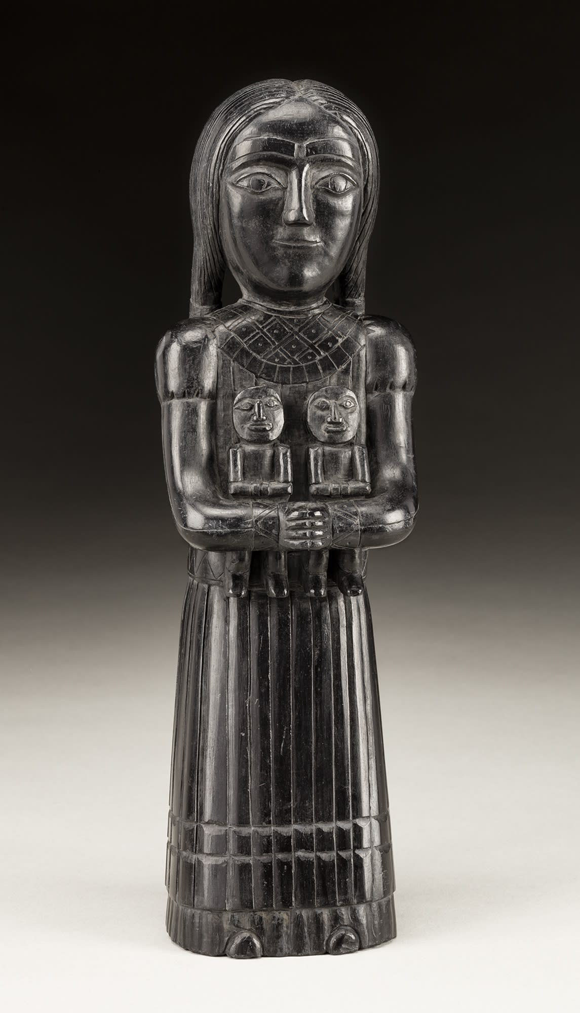 Lot 51 UNIDENTIFIED ARTIST, HAIDA Female Figure Holding Two Dolls, c. 1840-1860 argillite, 10.75 x 3.25 x 2.25 in (27.3 x 8.3 x 5.7 cm) Estimate: $18,000 — $28,000 Price realized: $38,400