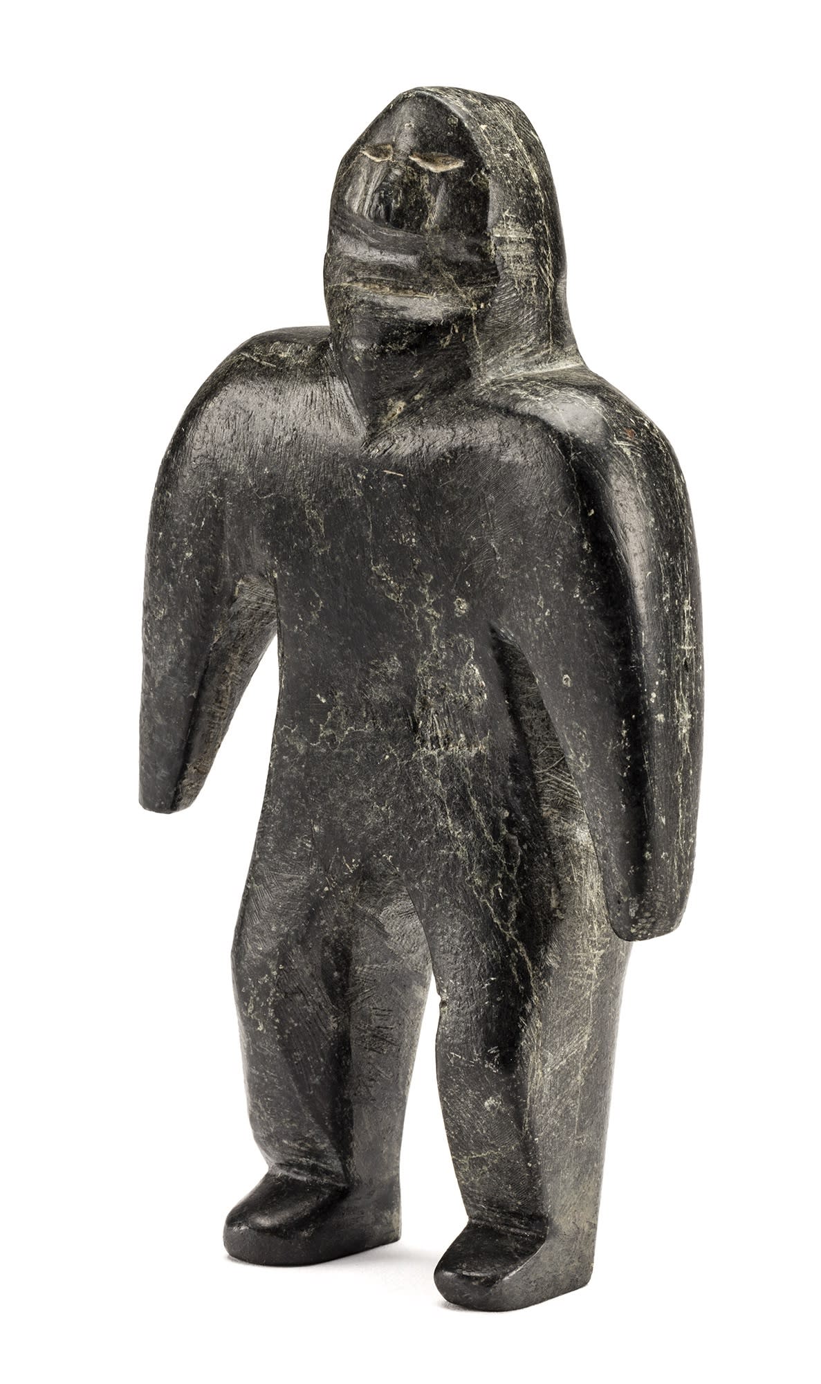 Lot 57 JOHN KAVIK (1897-1993) KANGIQLINIQ (RANKIN INLET) Standing Man, 1973 stone, 8.25 x 4.5 x 1.25 in (21 x 11.4 x 3.2 cm) Estimate: $4,000 — $6,000 Price realized: $3,840