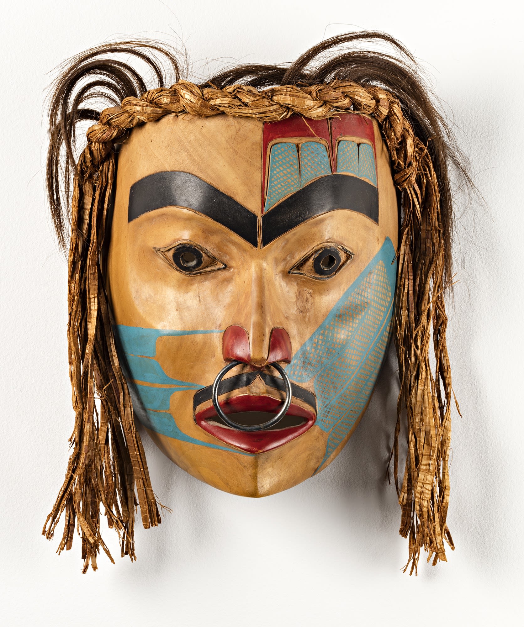 Lot 69 FREDA DIESING (1925-2002), HAIDA, PRINCE RUPERT Portrait Mask, 1971 alder, cedar bark, hair, metal, and paint, 8 x 6 x 4.5 in (20.3 x 15.2 x 11.4 cm) excluding hair Estimate: $5,000 — $7,000 Price realized: $36,000