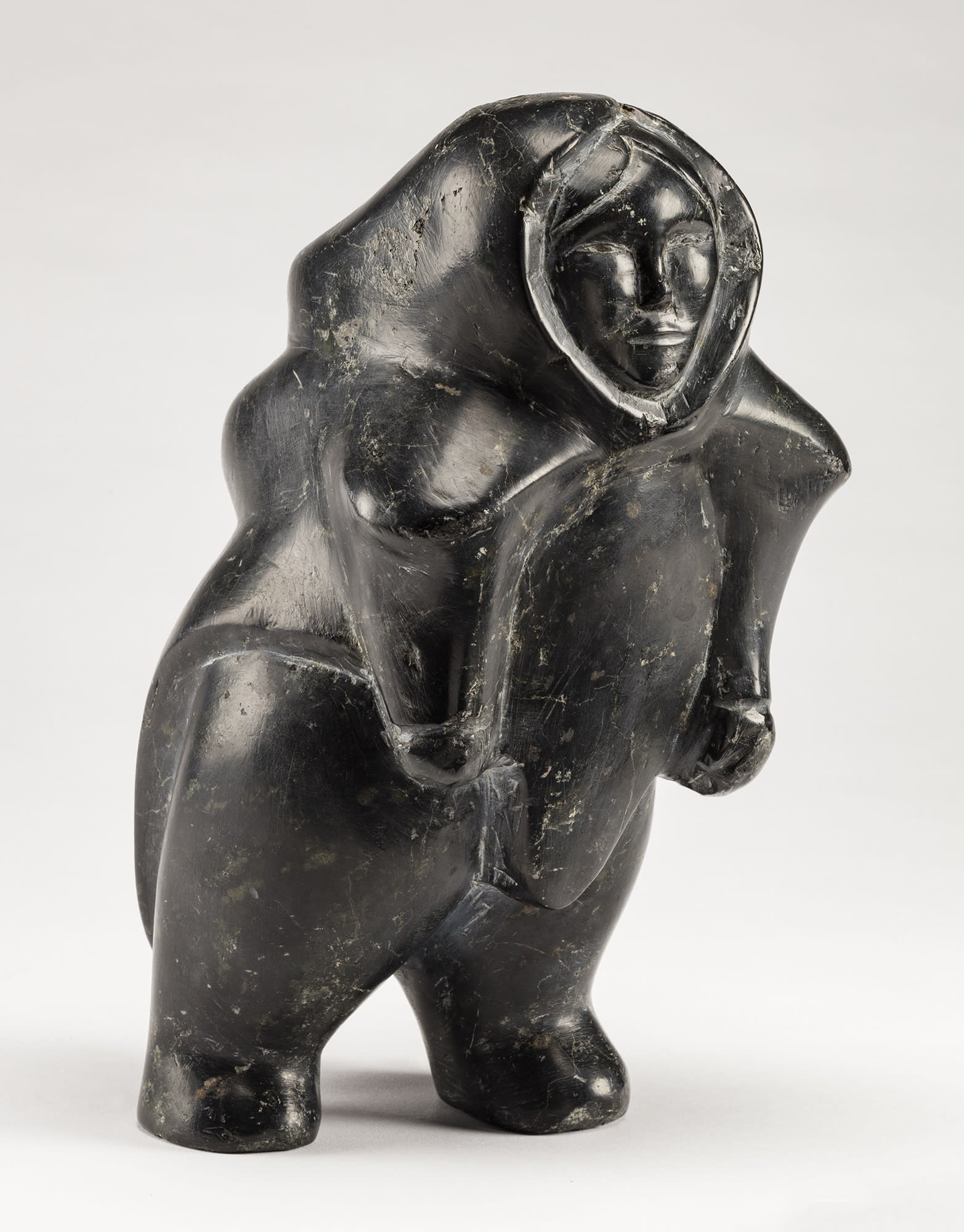 Lot 97 DOMINIC KINGILIK (1939-1990), QAMANI'TUAQ (BAKER LAKE) Walking Woman, 1964 stone, 10.5 x 6 x 6 in (26.7 x 15.2 x 15.2 cm) ESTIMATE: $3,500— $5,000 PRICE REALIZED: $3,360