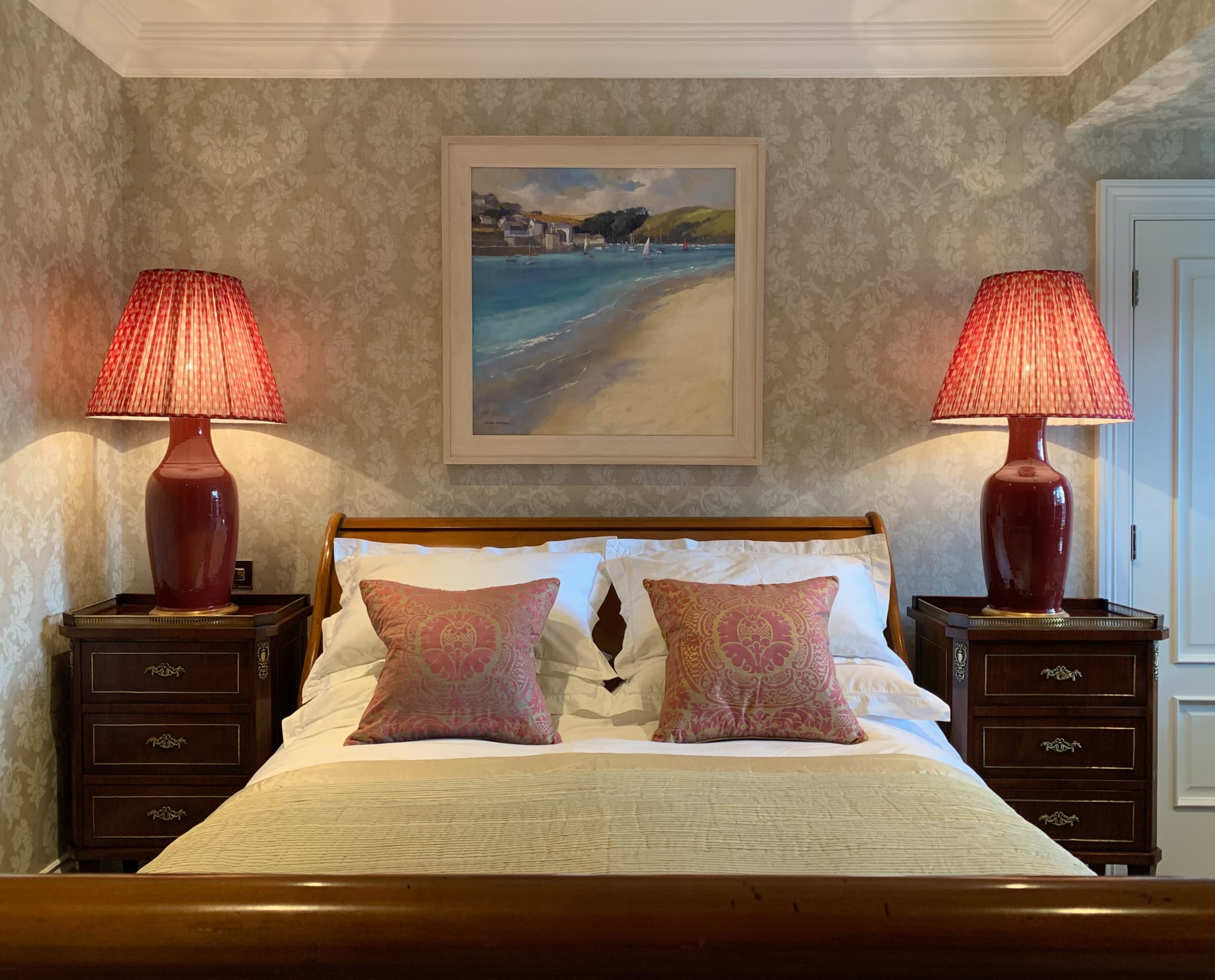 A relaxing coastal themed painting by Jane Lampard for this classic bedroom scheme