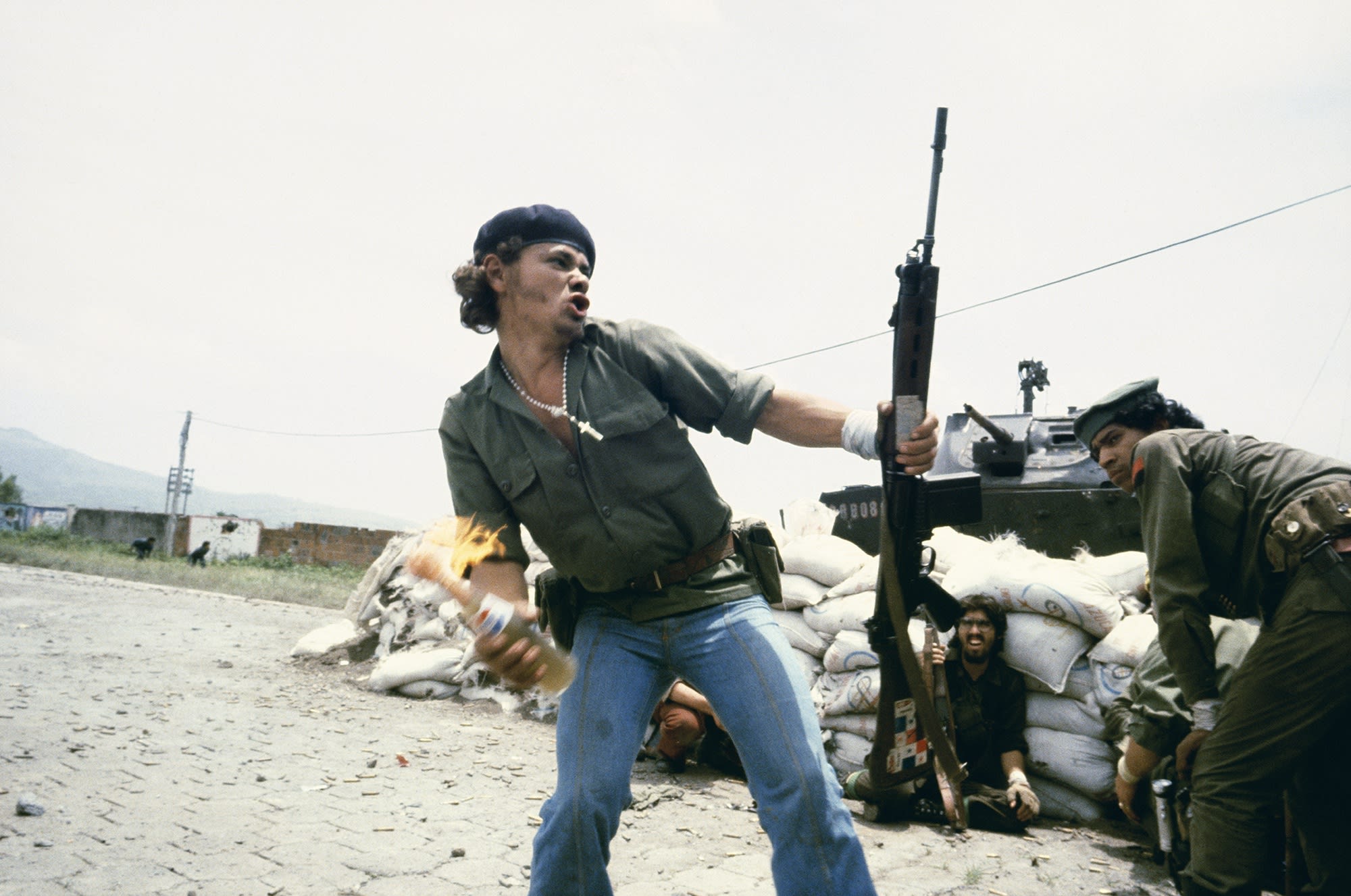 Susan Meiselas Sandinistas at the walls of the Estelí National Guard headquarters: 'Molotov Man', Estelí, Nicaragua, July 16th, 1979, 1979 Chromogenic print 16 x 20 inches (40.6 x 50.8 cm)