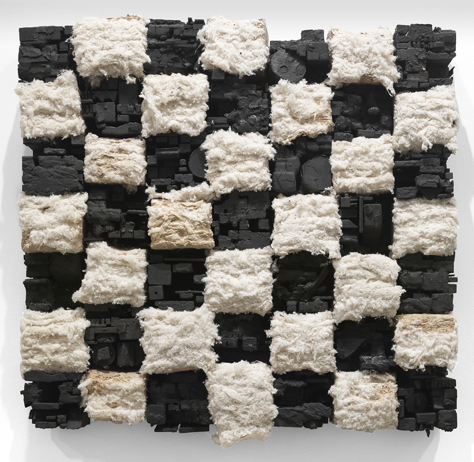 Leonardo Drew Number 264, 2020 Wood, paint, and cotton 34 x 37 x 7 inches (86.4 x 94 x 17.8 cm) In this new work, Drew depicts an abstracted landscape of white and black squares, arranged in a formal checkerboard grid. The artist transforms raw material to articulate overlapping themes with emotional gravitas; the use of cotton is an immediate reference to the labor history of African-Americans in the US. At once monumental and intimate in scale, his work recalls post-Minimalist sculpture that alludes to America’s industrial past. Currently, Drew is the subject of three solo museum exhibitions at the Mississippi Museum of Art, Jackson; North Carolina Museum of Art, Raleigh; and the Sidney and Lois Eskenazi Museum of Art, Bloomington, Indiana.