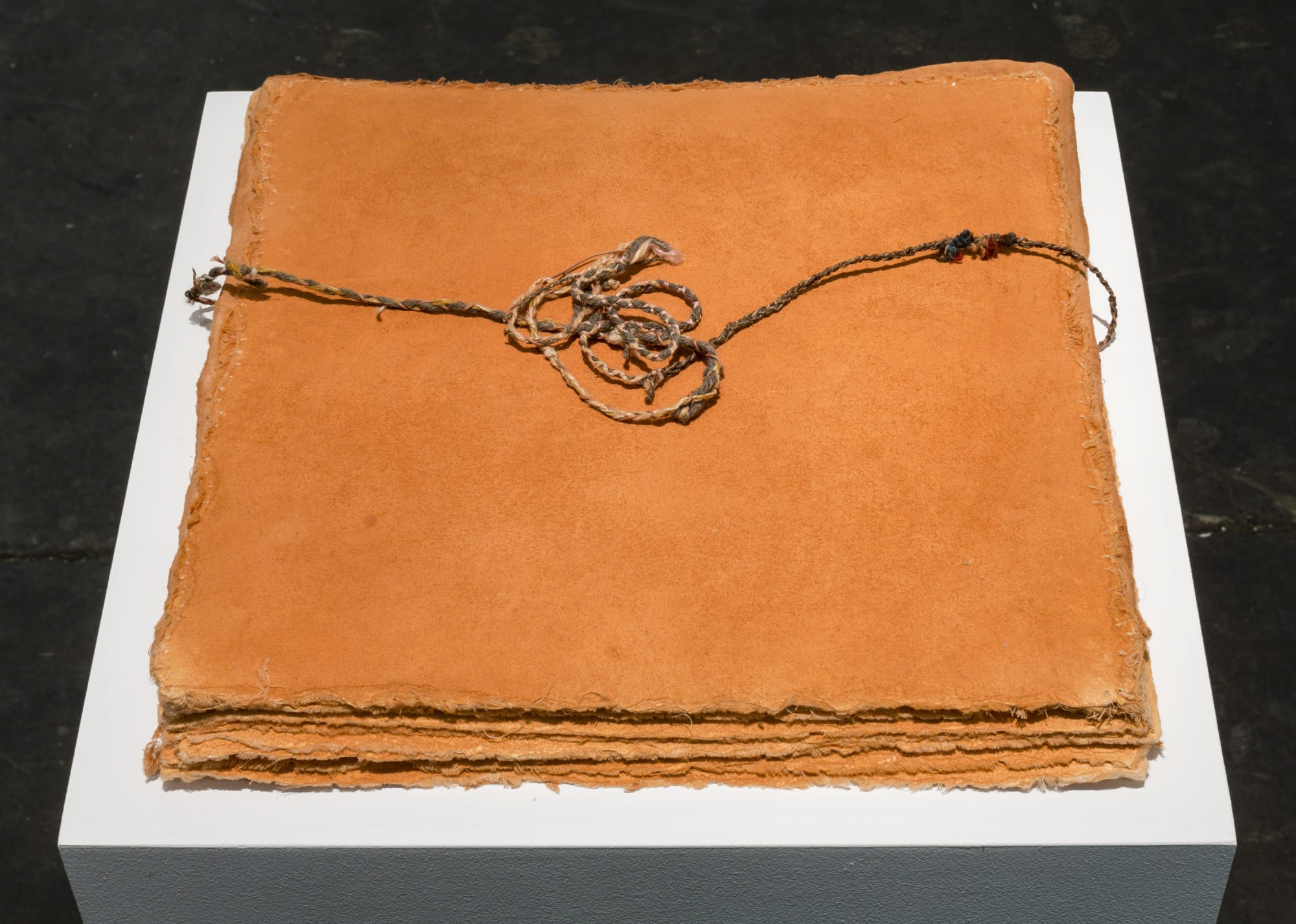 Michelle Stuart Adena, 1978 Earth from site, woven string, cloth, muslin-mounted rag paper 14 x 14 x 1 inches (35.6 x 35.6 x 2.5 cm) GL14514