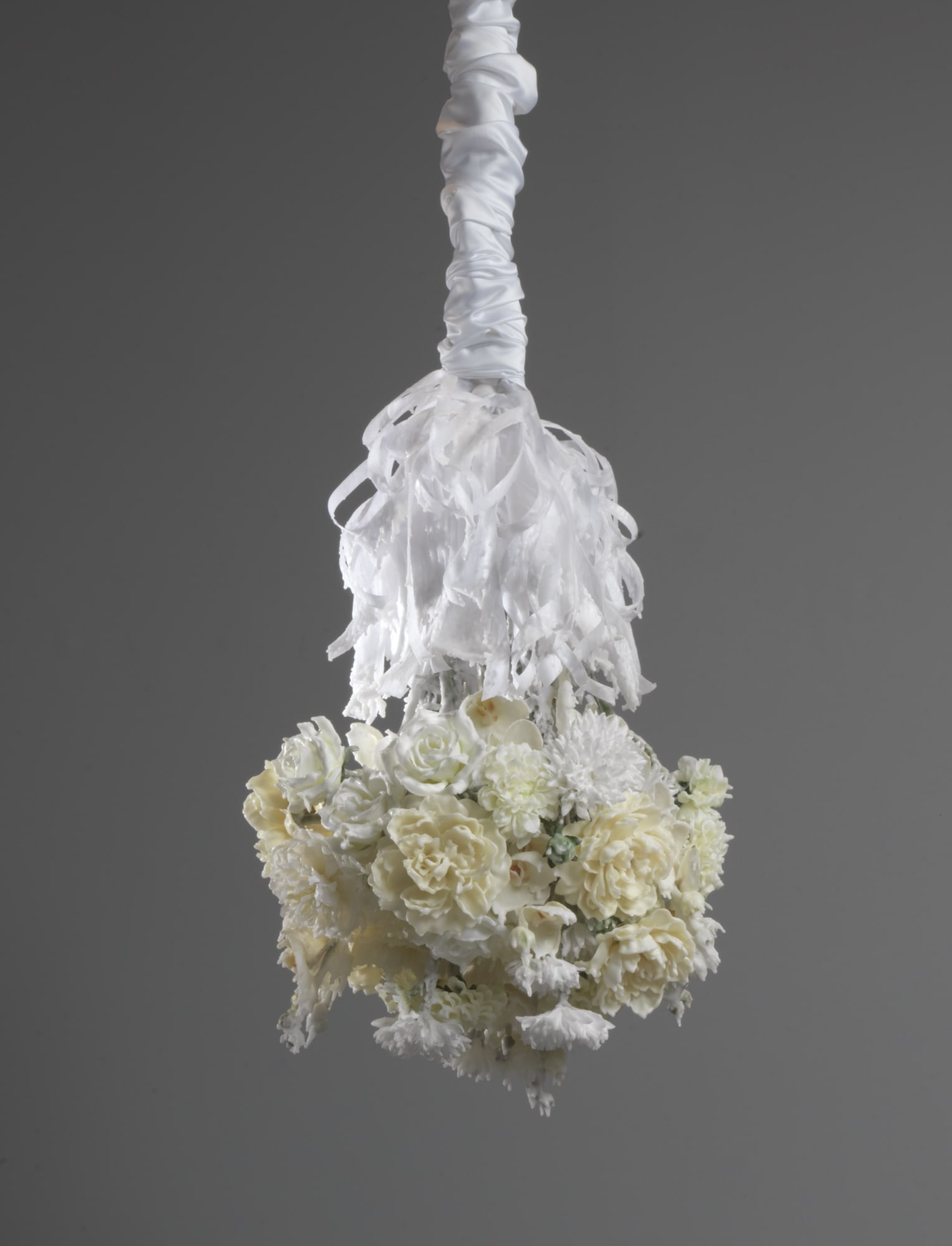 Petah Coyne Untitled #1419 (Bruno Schulz: The Street of Crocodiles), 2016 Specially-formulated wax, pigment, silk flowers, ribbons, steel, steel rods, wire, tape, epoxy, 3/8" Grade 30 proof coil chain, quick-link shackles, jaw-to-jaw swivel, silk Duchesse satin, Velcro, thread, paper towels, plastic 39 x 20 x 20 inches (99.1 x 50.8 x 50.8 cm)