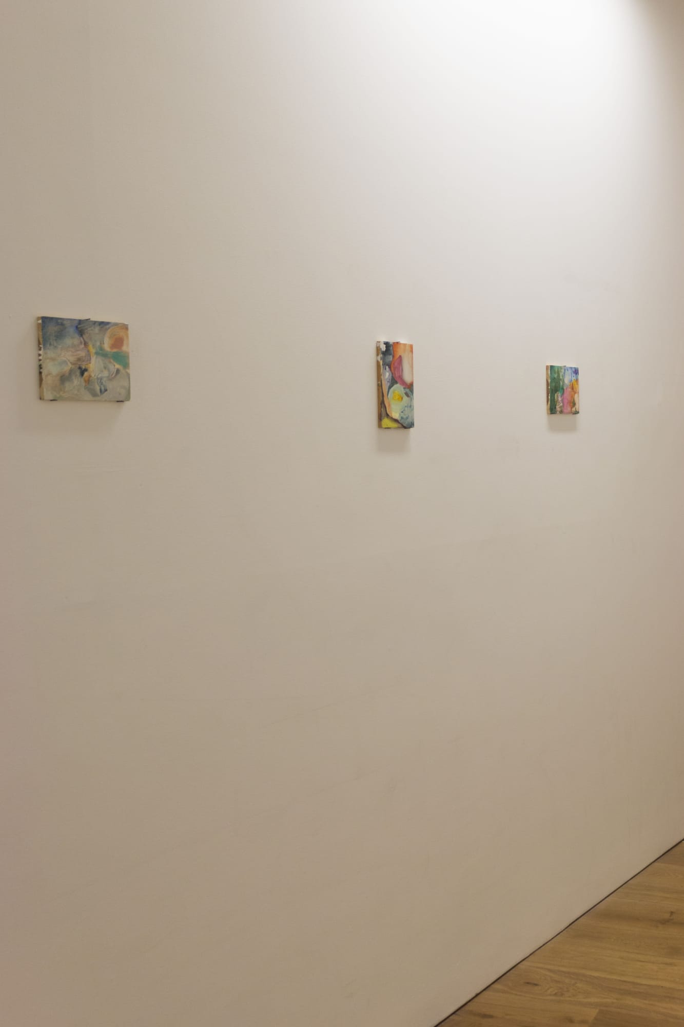 Susan Rocklin, (left to right) becoming the fall, oil on wood. egg woman, oil on wood. sleeping in the alps, oil on wood.