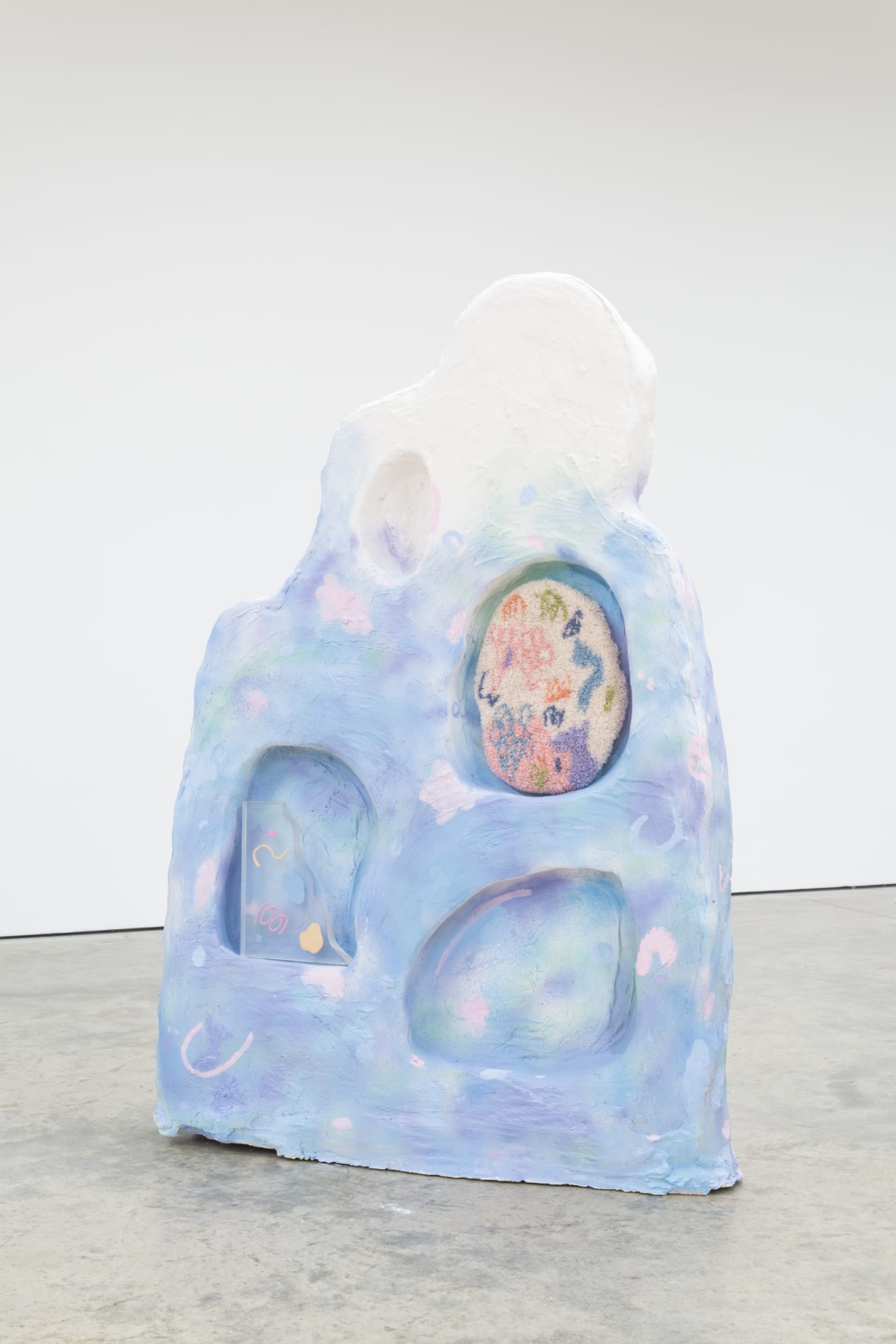 Sebastian Sochan .I still believe in us and our frame 2021, Foam, plaster, white concrete, spray, resin, clay and rug, 123 x 80 x 13 cm